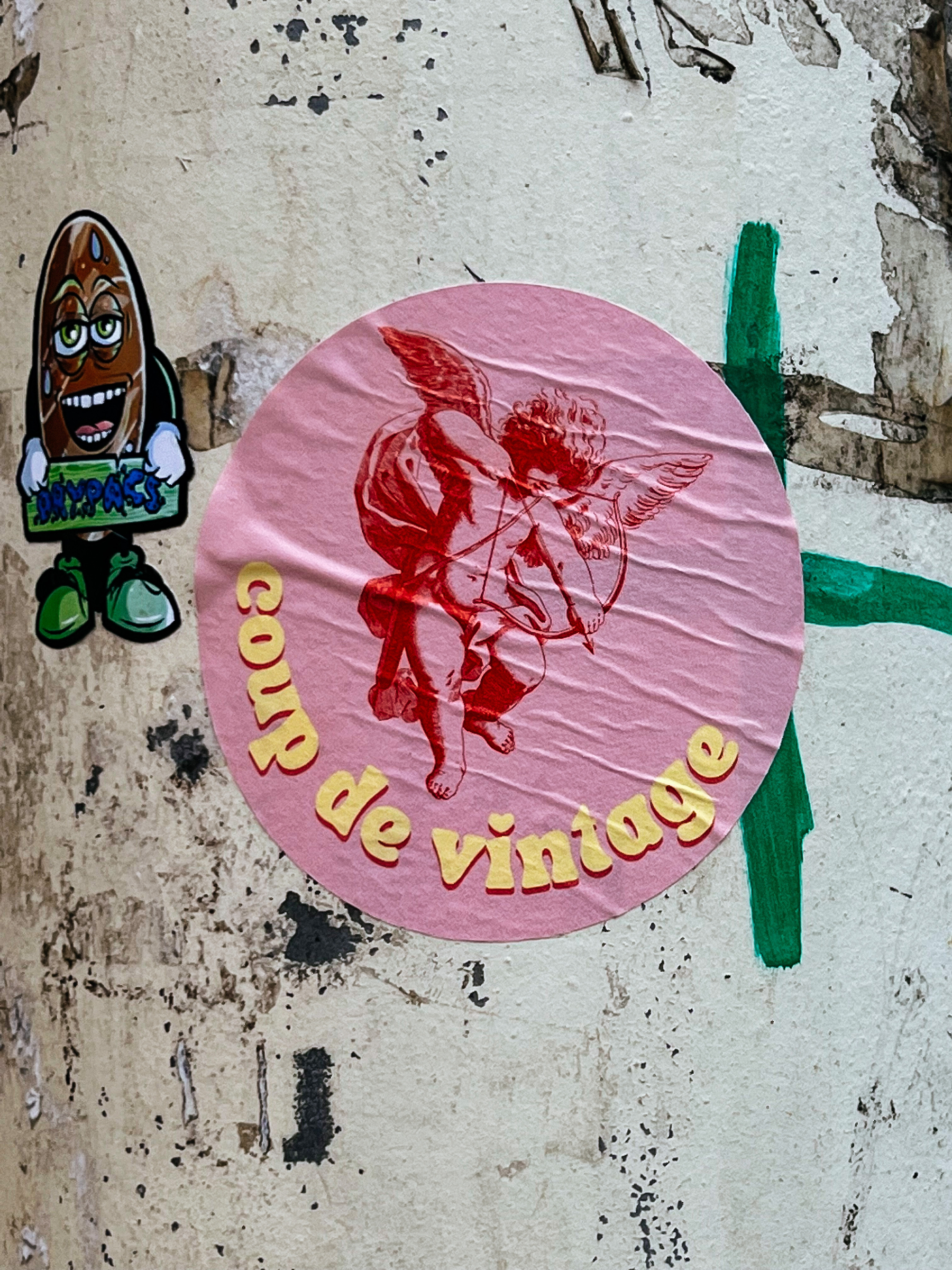 Sticker with a picture of Cupid, and the words “Coup de Vintage”. 