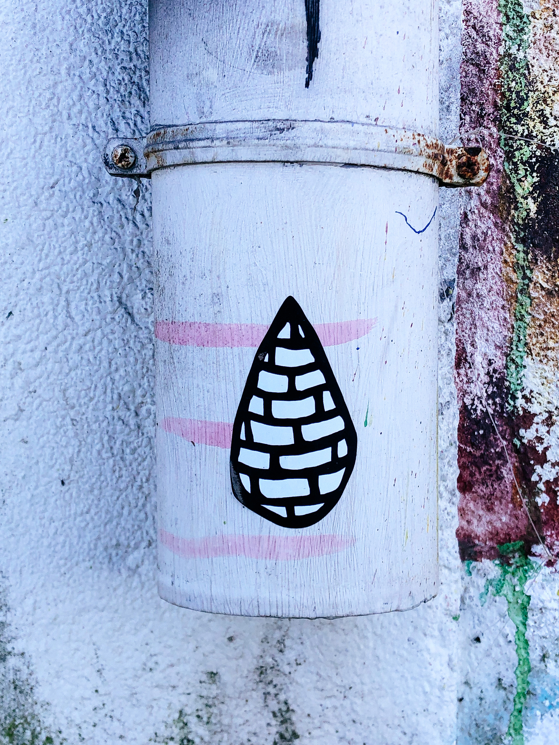A sticker of what looks like a drop made of bricks.