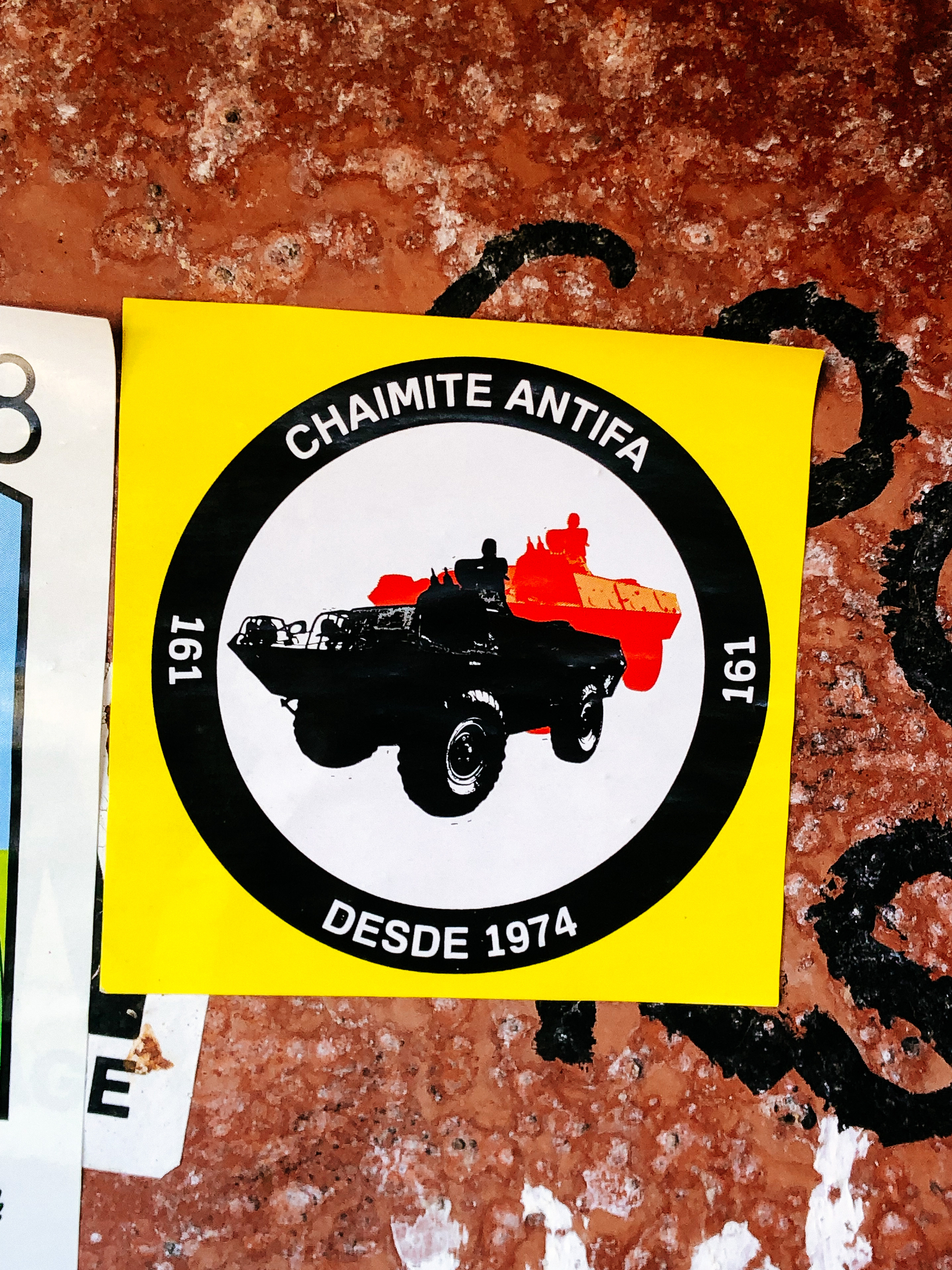 A sticker with an APC vehicle, and the words “chaimite antifa since 1974”