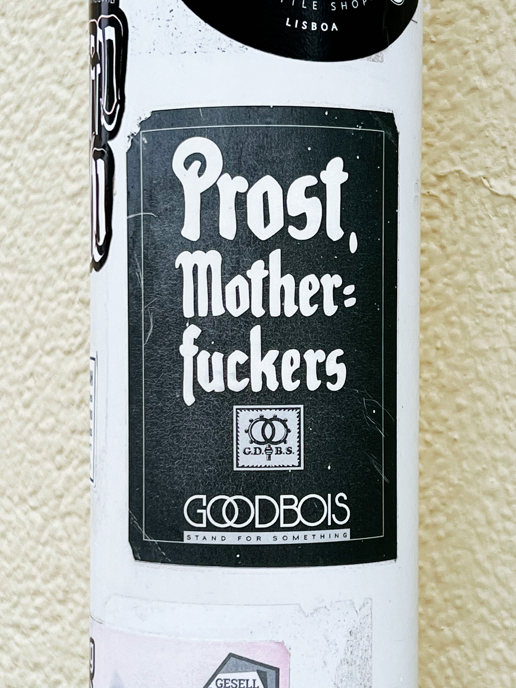 Sticker with the words “Prost, mother fuckers”. 