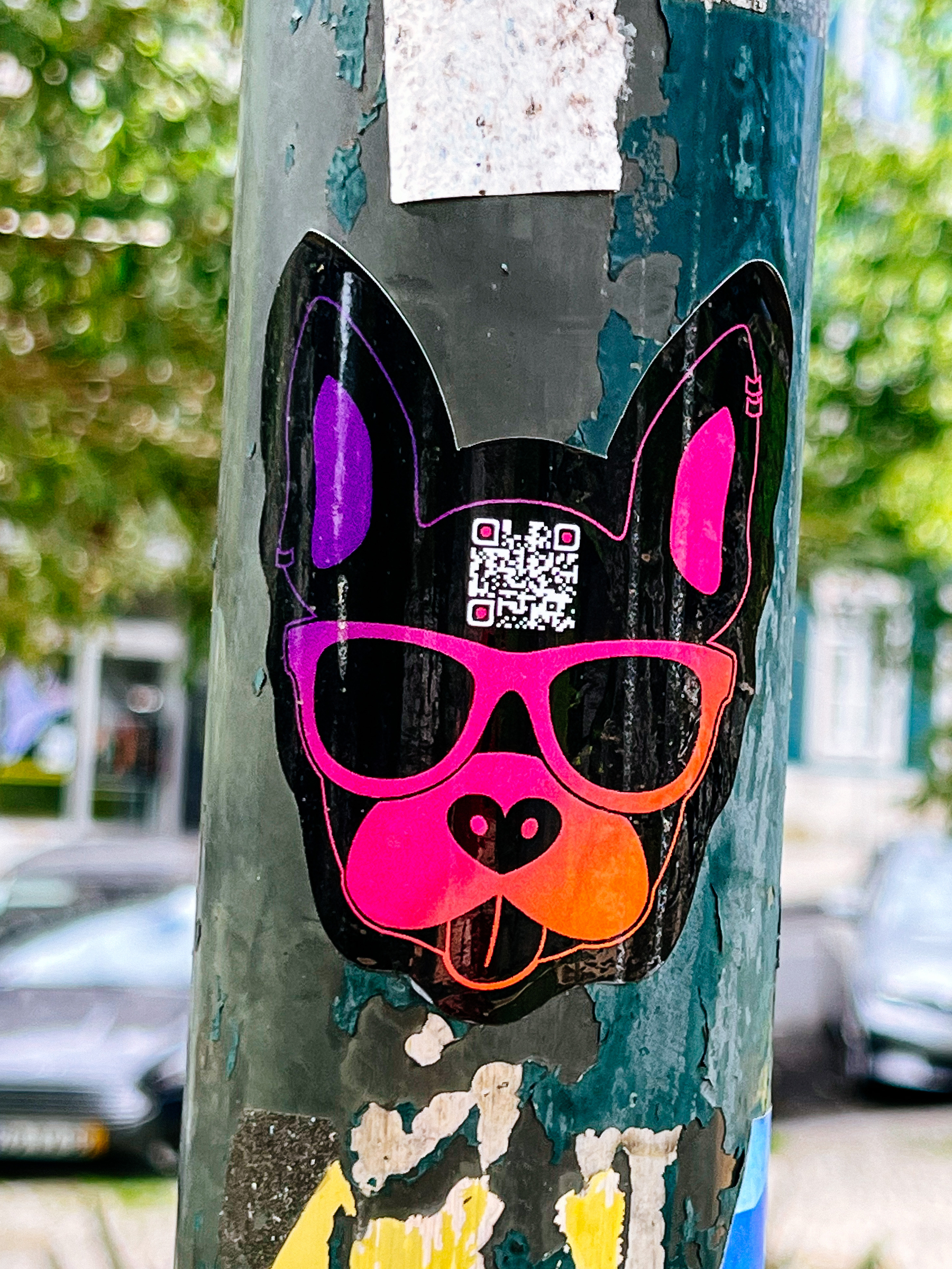 Sticker of a dog, with a QR code on the forehead 