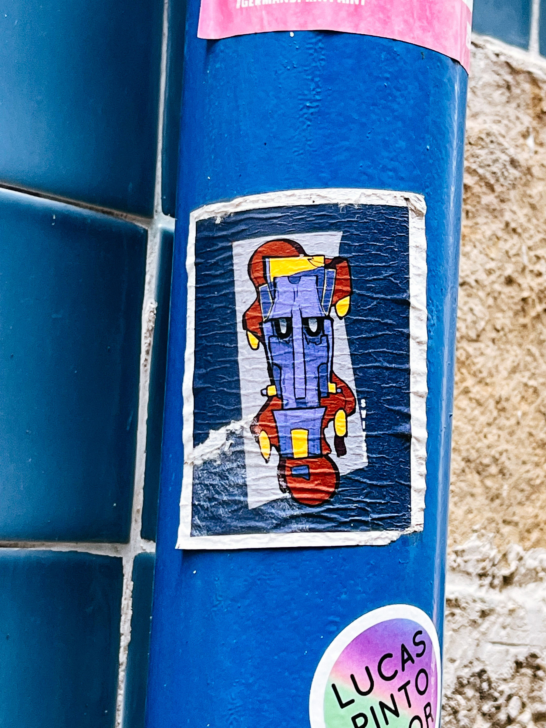 Sticker of a blue robot face. 