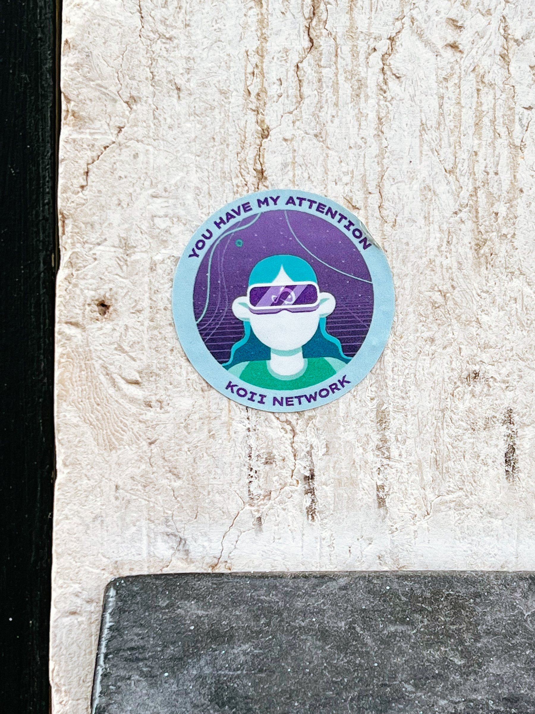 Sticker “you have my attention”, with a face with wrap around shades. 