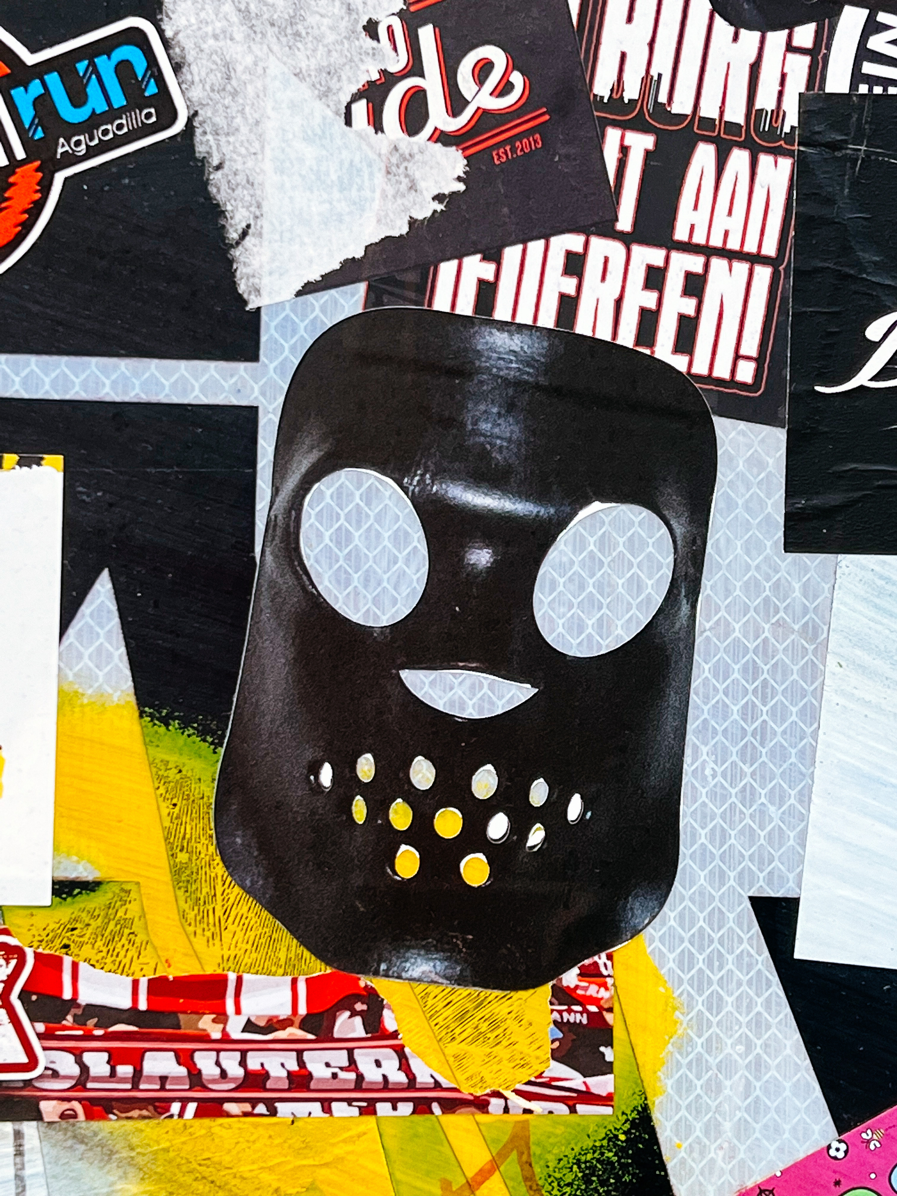 Sticker of a leather mask. 