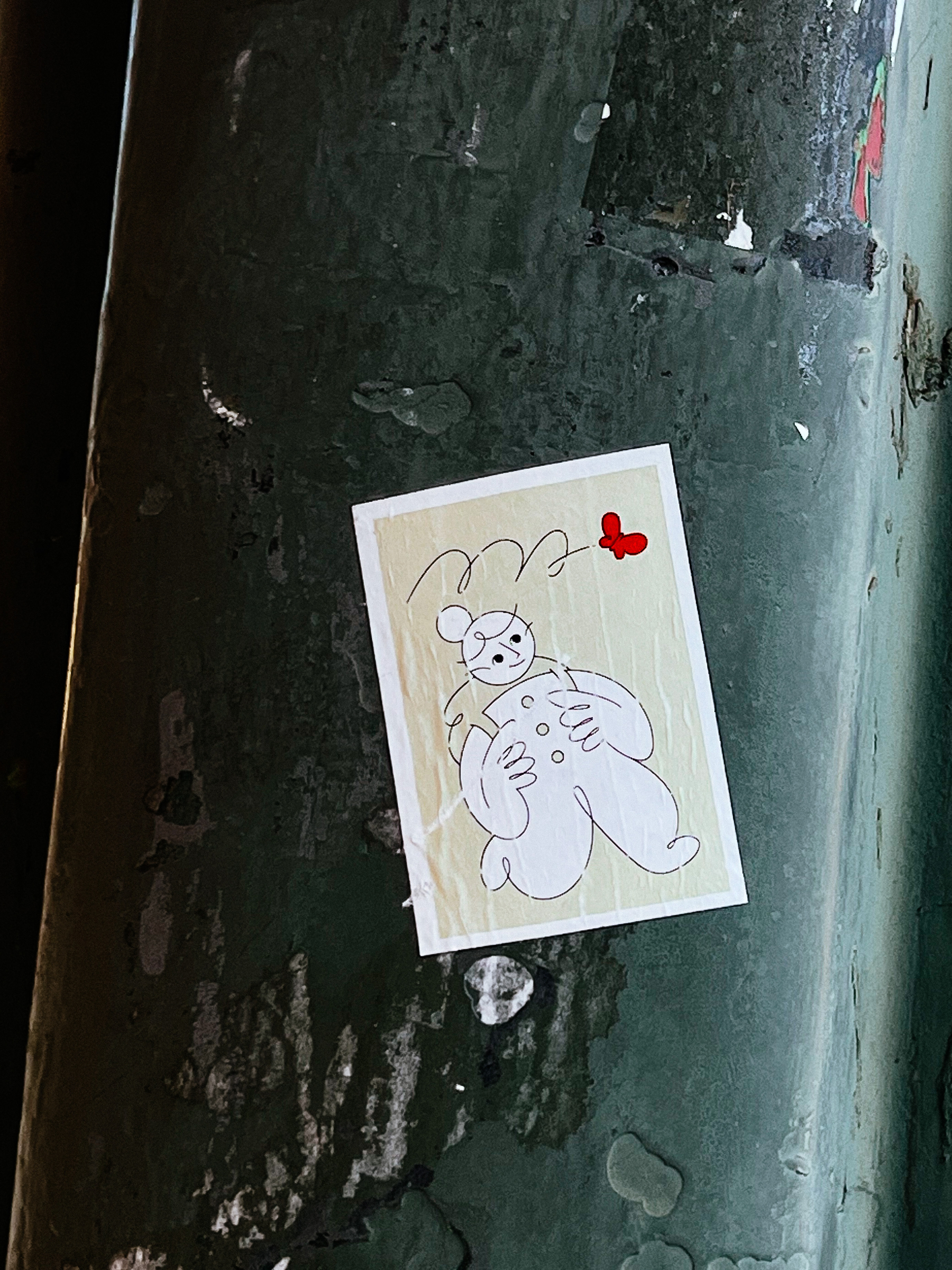 Sticker with a cute drawing of a girl with a backpack, looking at a red butterfly. 