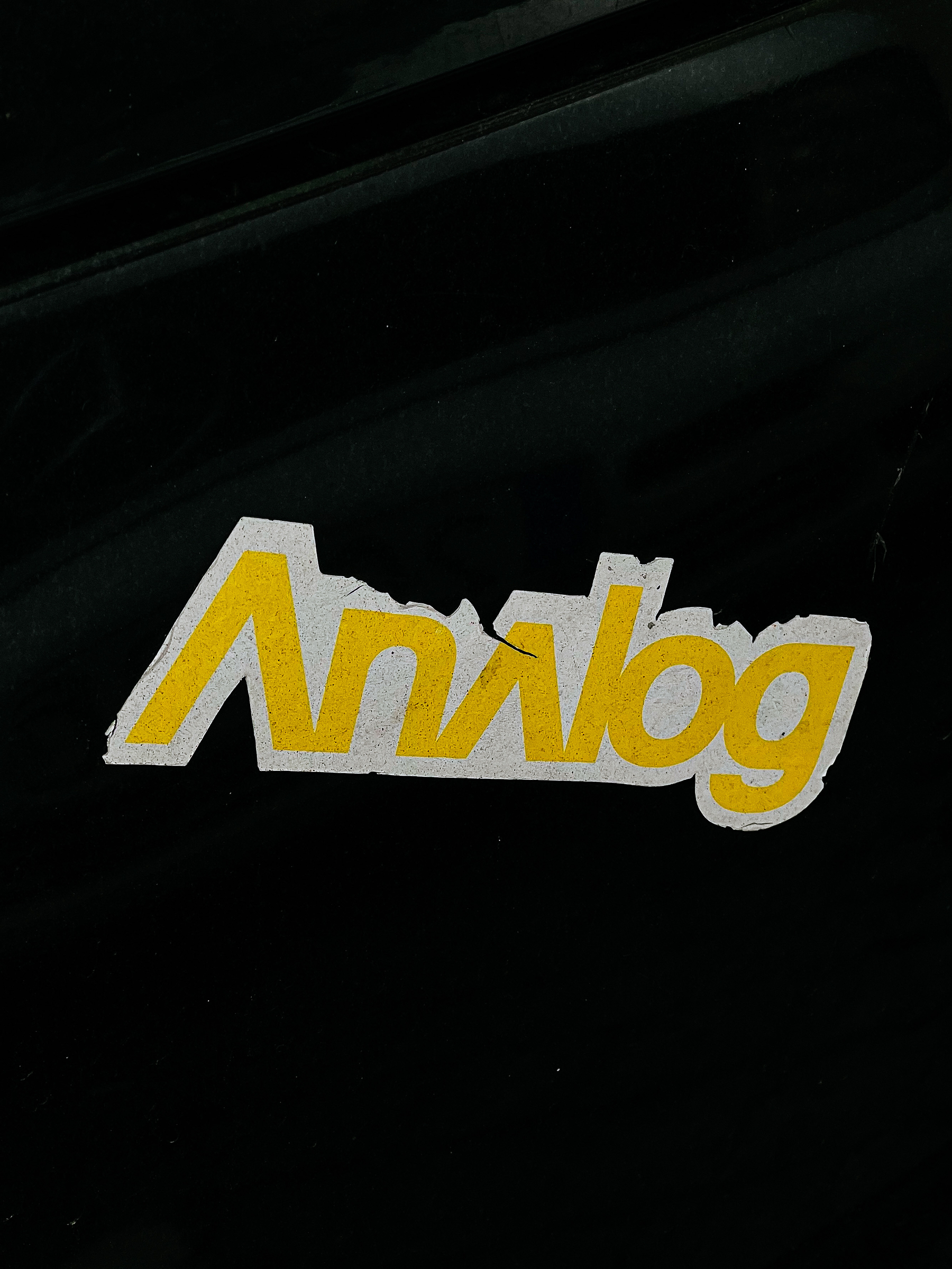 Sticker with the word “analog”. 