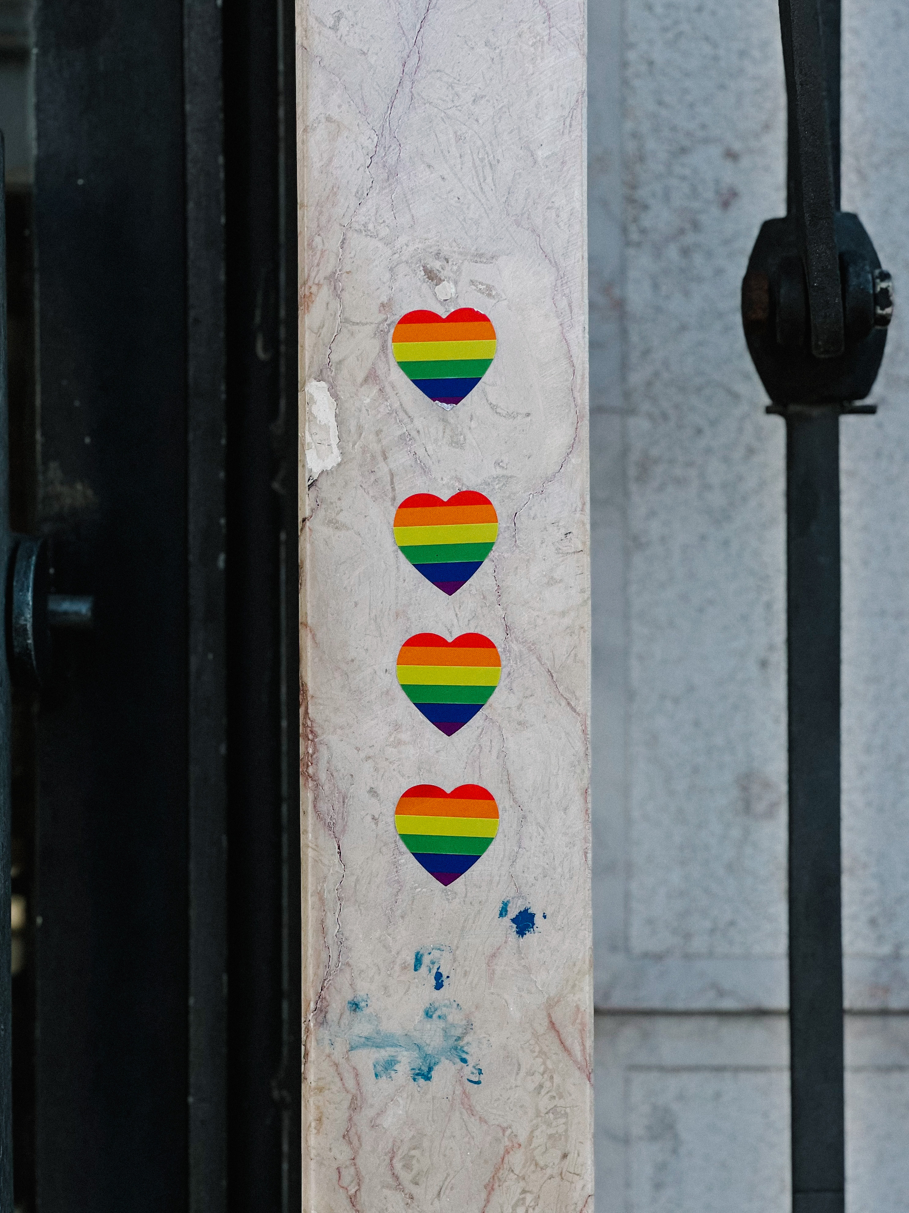 Four rainbow heart stickers. 