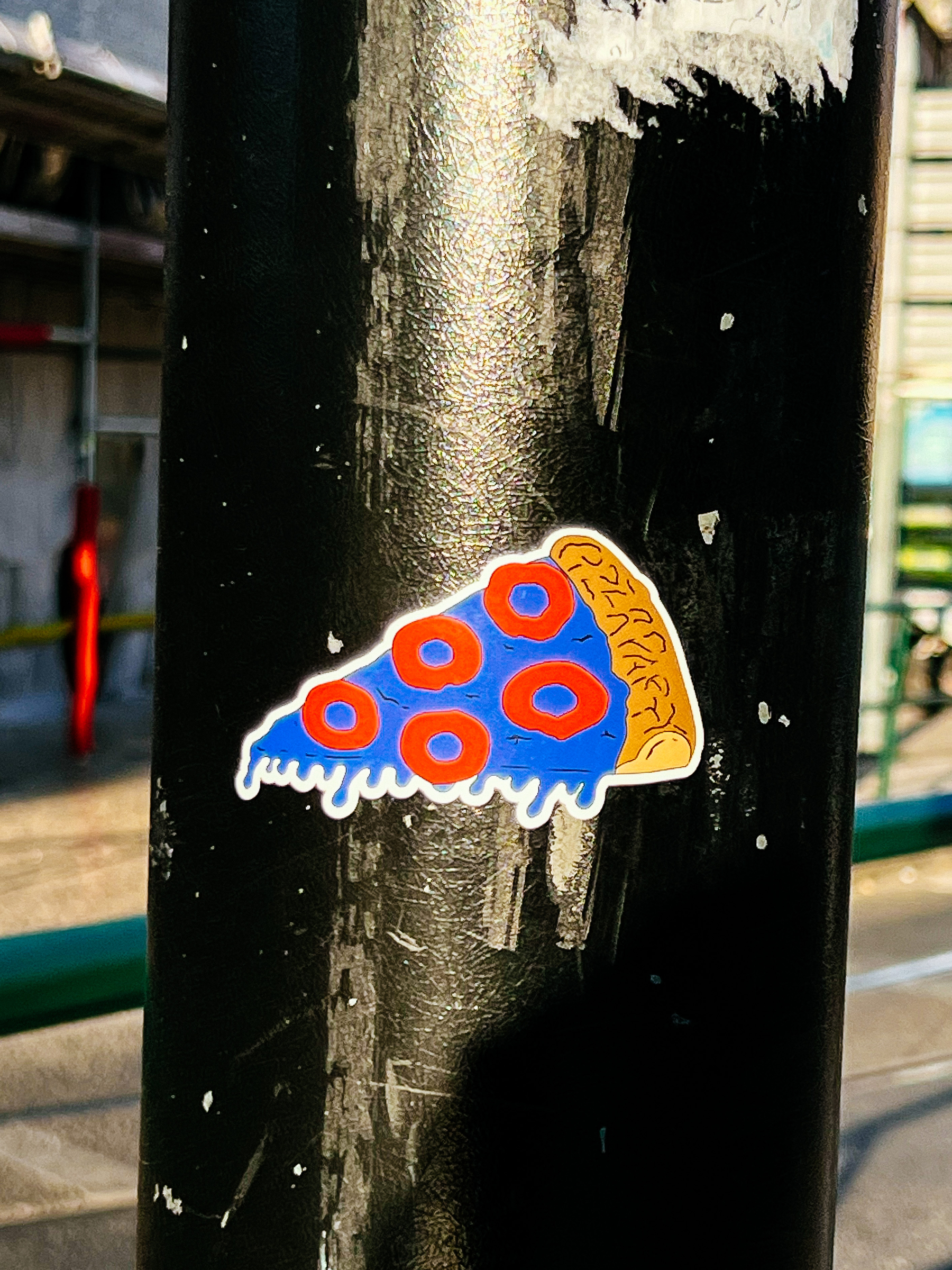 Sticker with a slice of blue pizza. 
