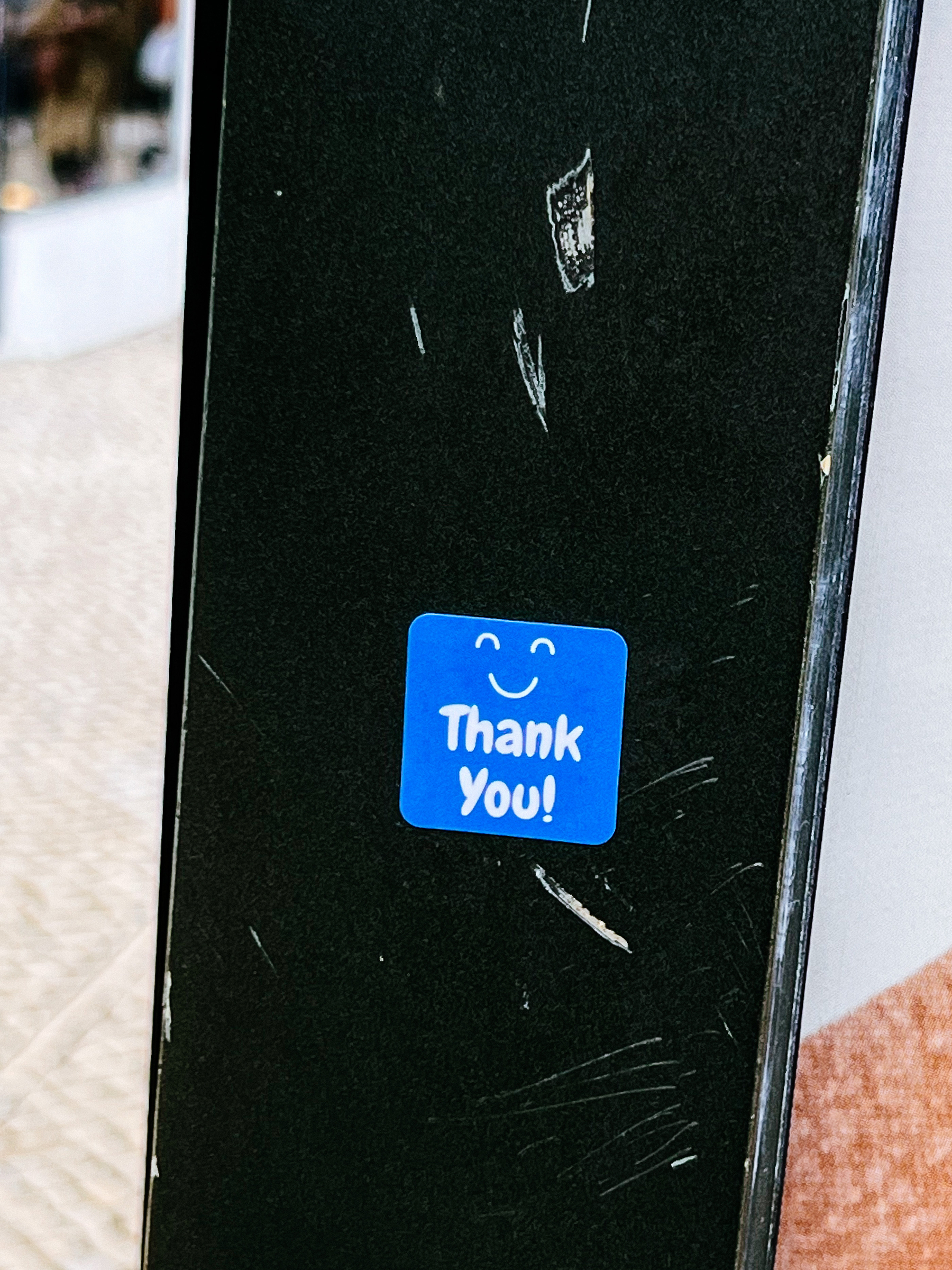 Sticker with a smily mouth and eyes, and the words “Thank you”.