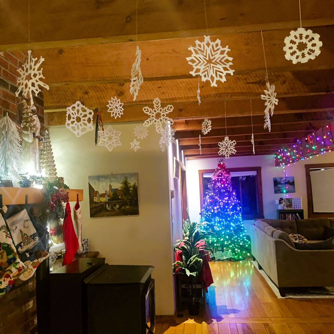 Living room with paper snowflakes hanging down. 