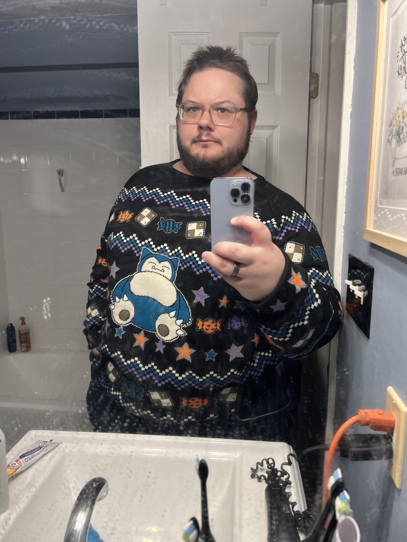 Overweight man in colorful pokemon sweater 