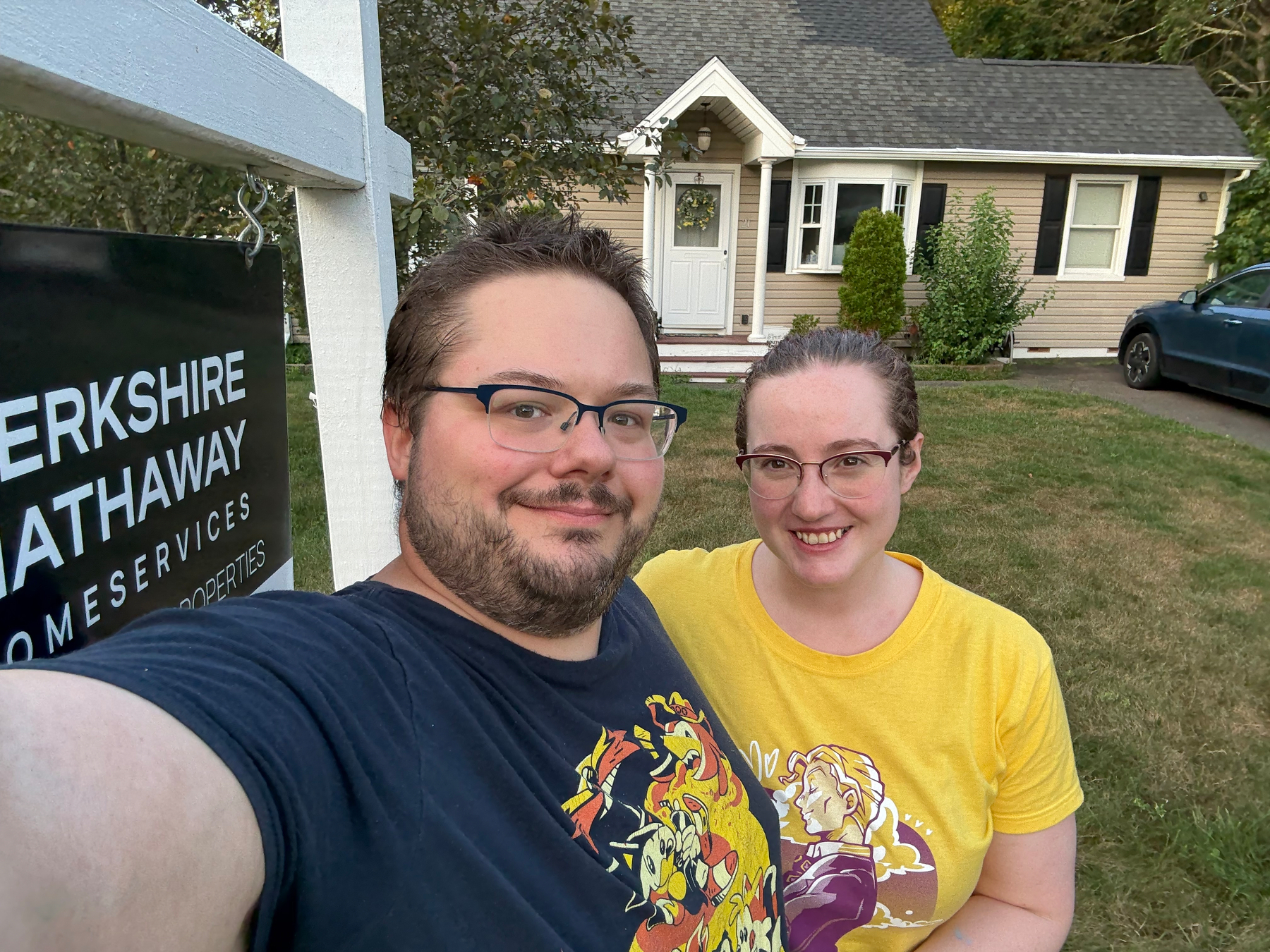 Couple in front of a house