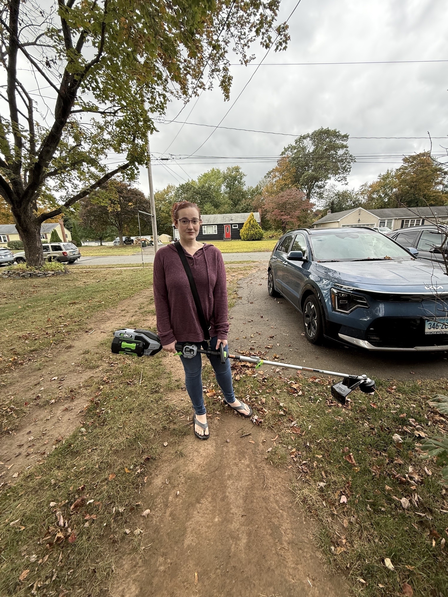 Woman holding a string trimmer 