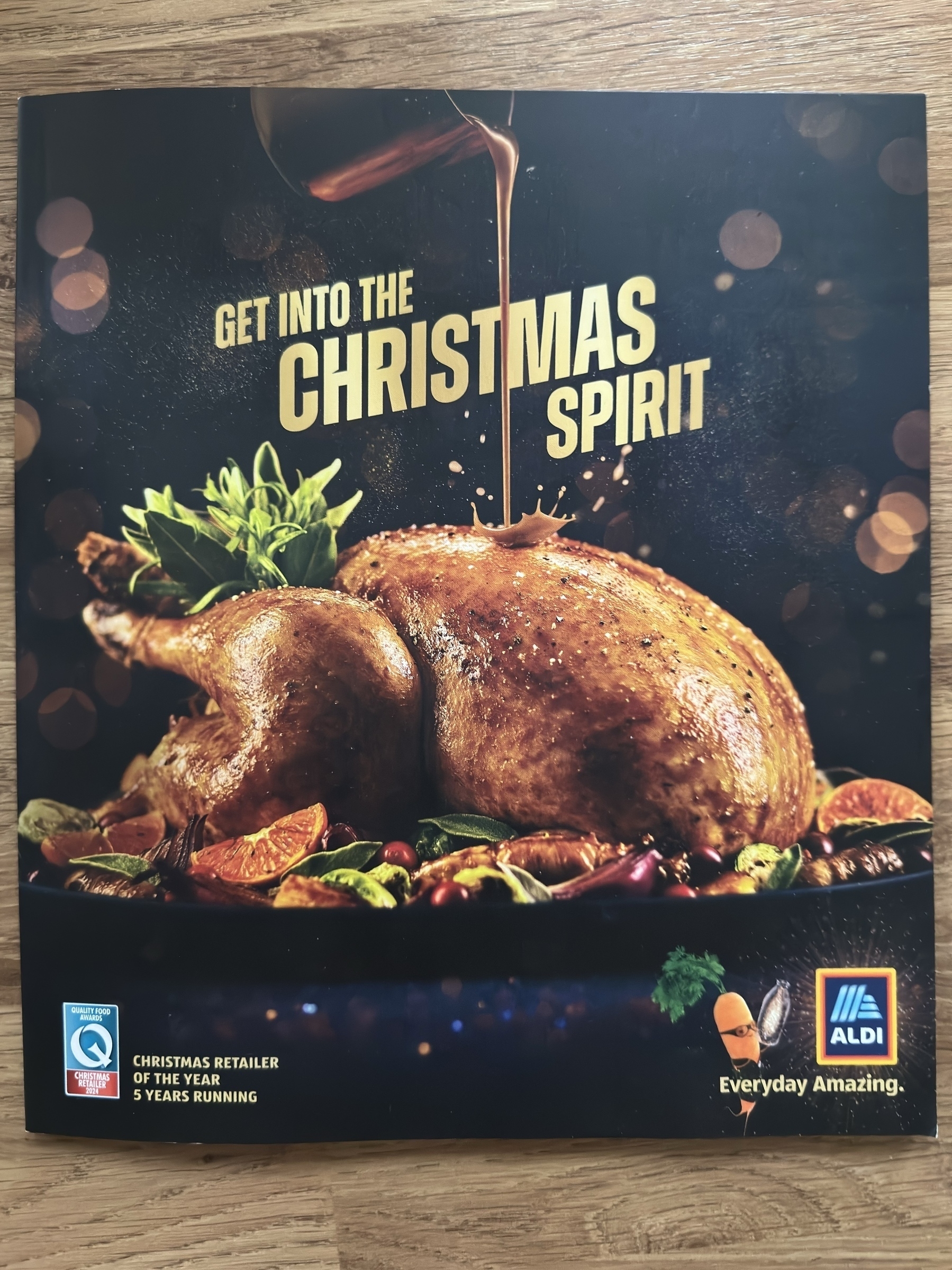 Front cover of the Aldi Christmas Catalogue, showing a  roast turkey on the cover.