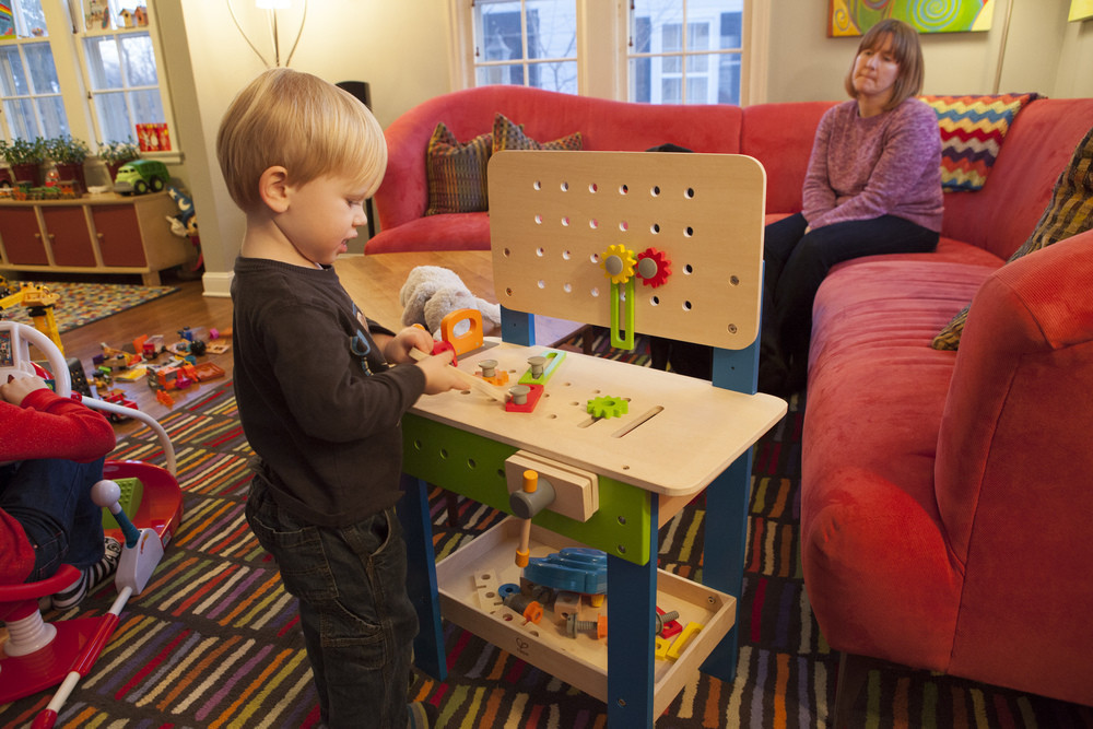 Tyler playing with his newworktable.