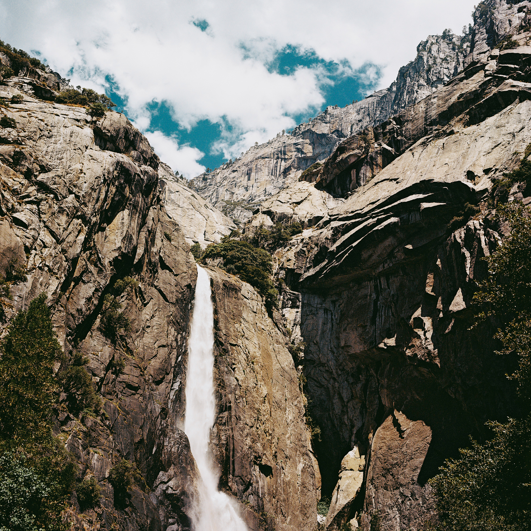 a scan of a color negative of a medium format photo. photo is of a waterfall in yosemite