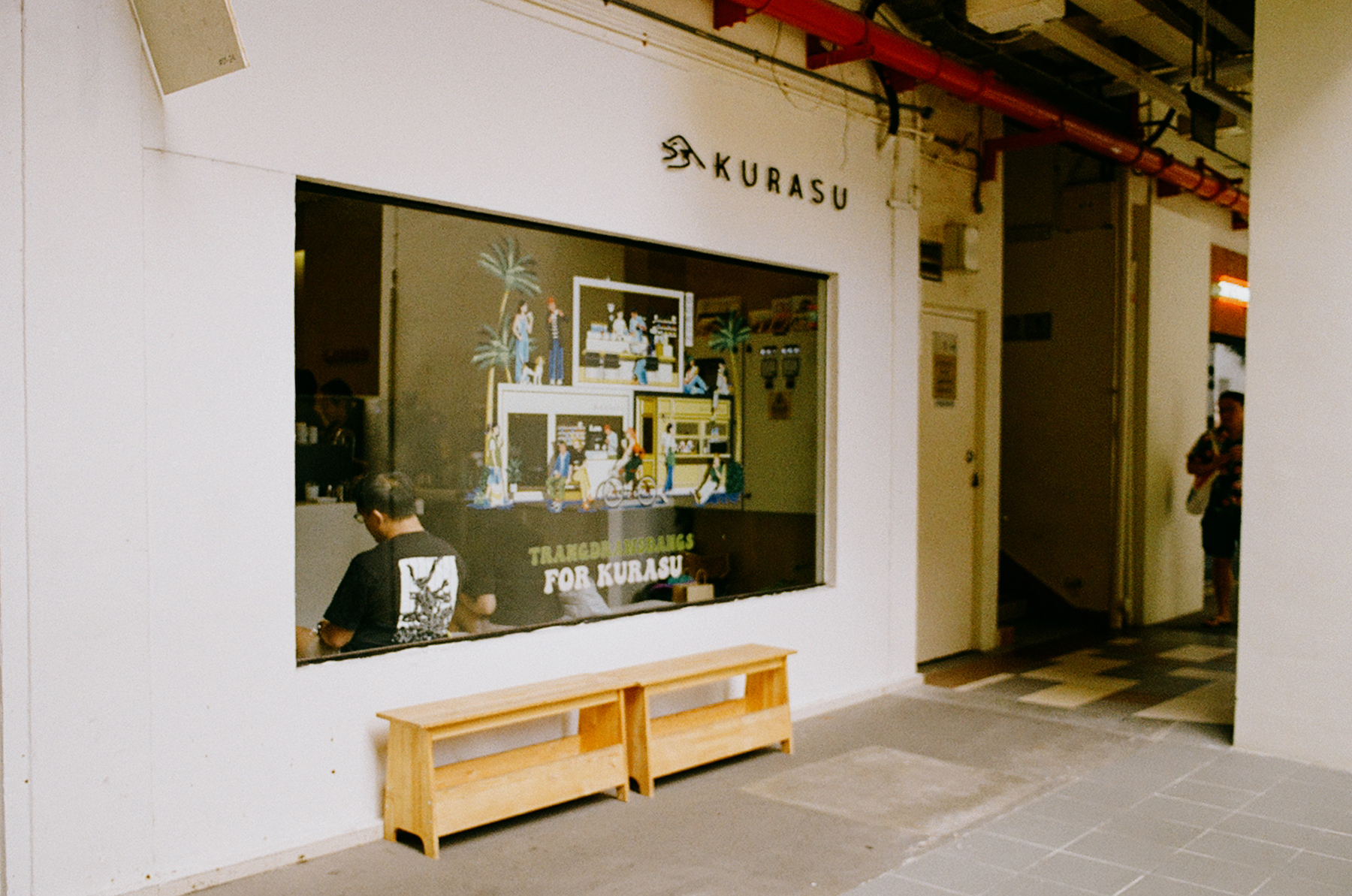 a scan of a color photo showing the exterior of a Japanese-inspired coffee shop in Singapore called Kurasu