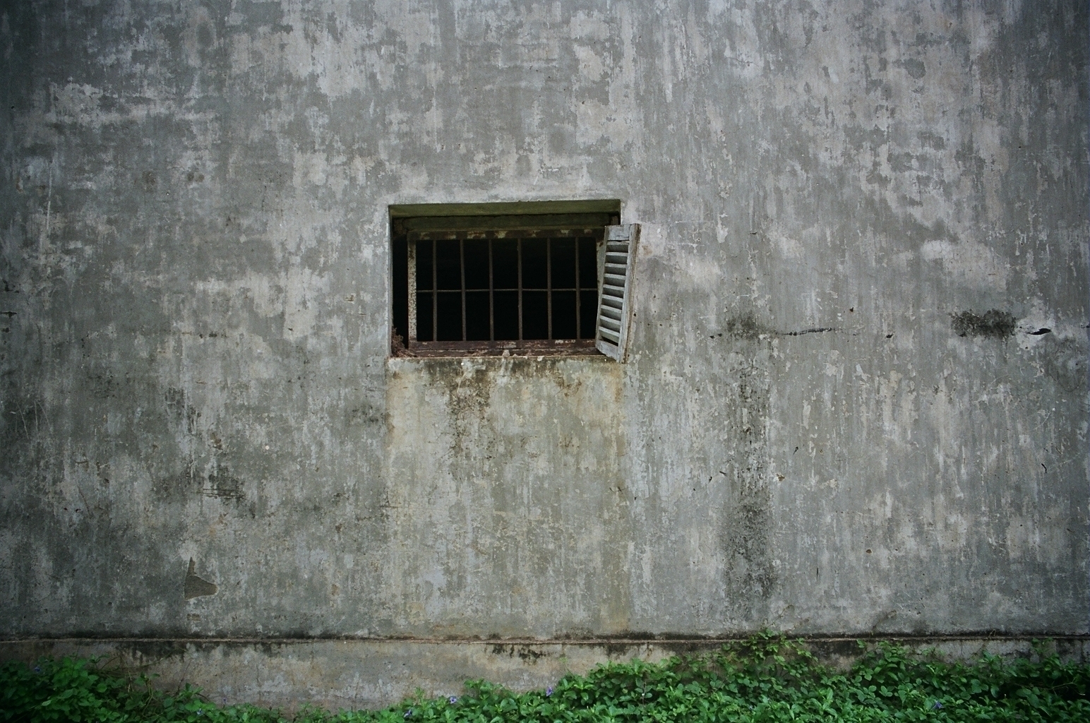 a scan of a color photo of a prison in Cambodia