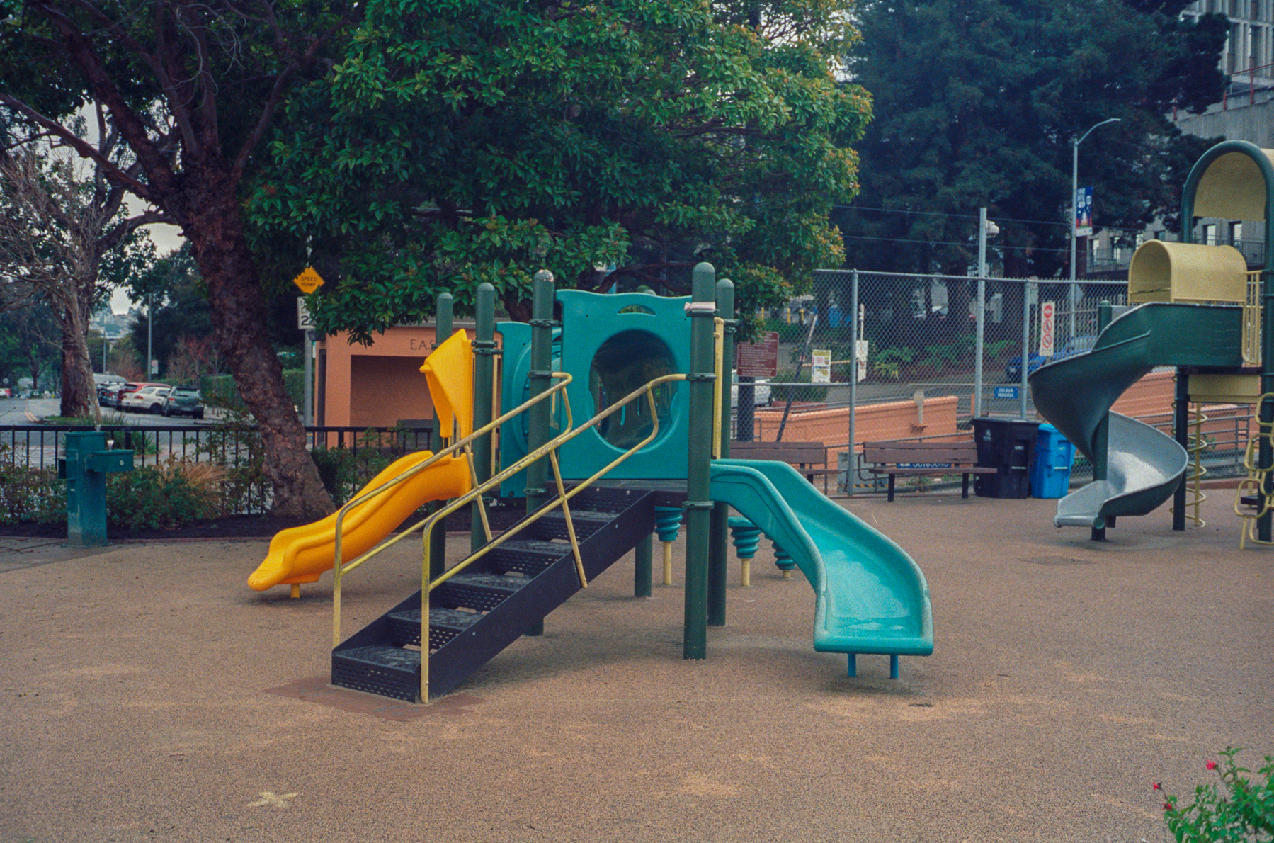 a scan of a color photograph of a multi-color playground in San Francisco