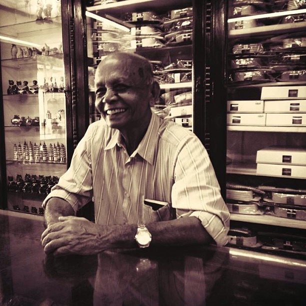 A black and white picture of a man in a department store in Sri Lanka
