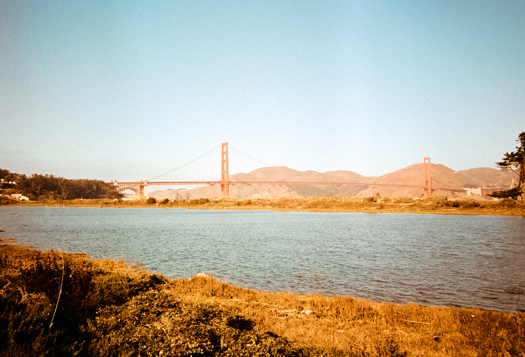 a scan of a color photo of the golden gate bridge on a sunny day