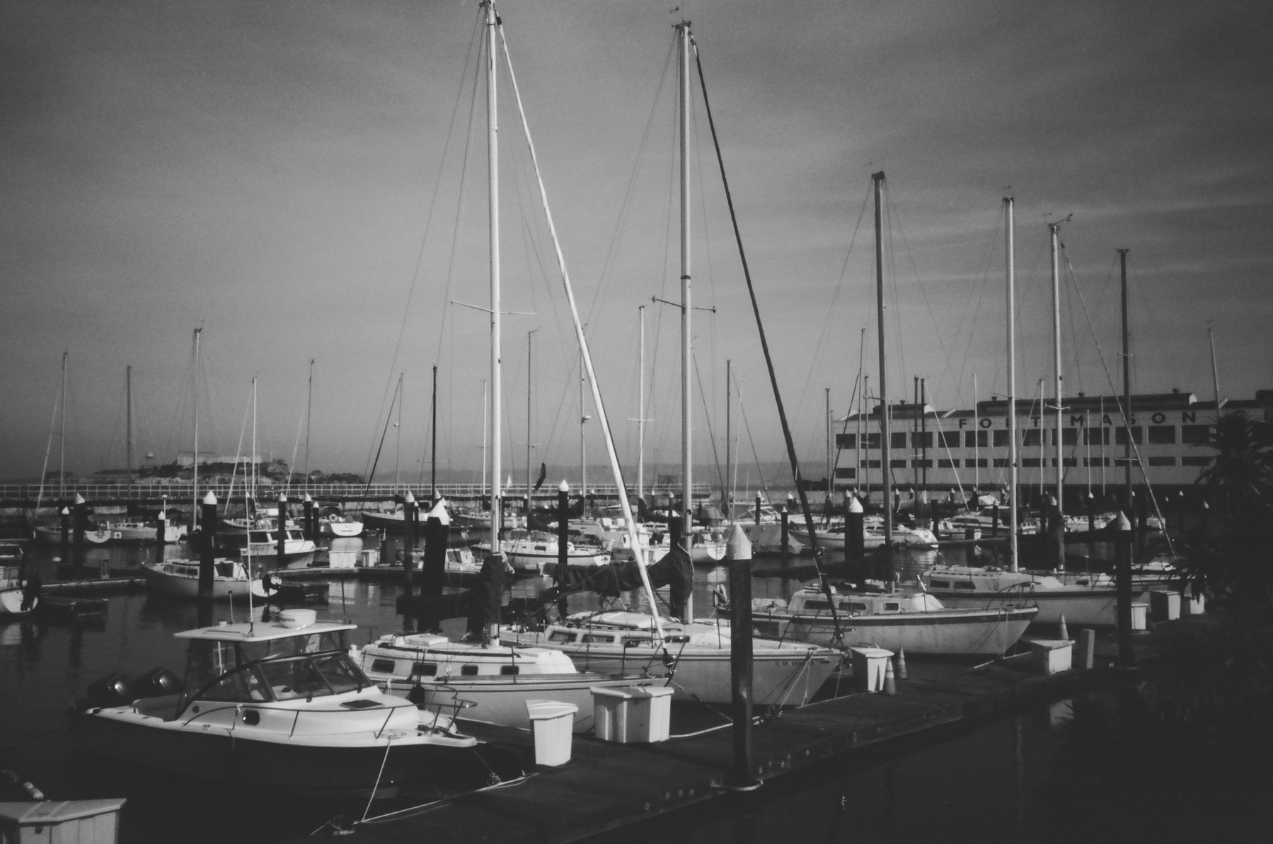 a black and white photograph of some yachts outside Fort Mason