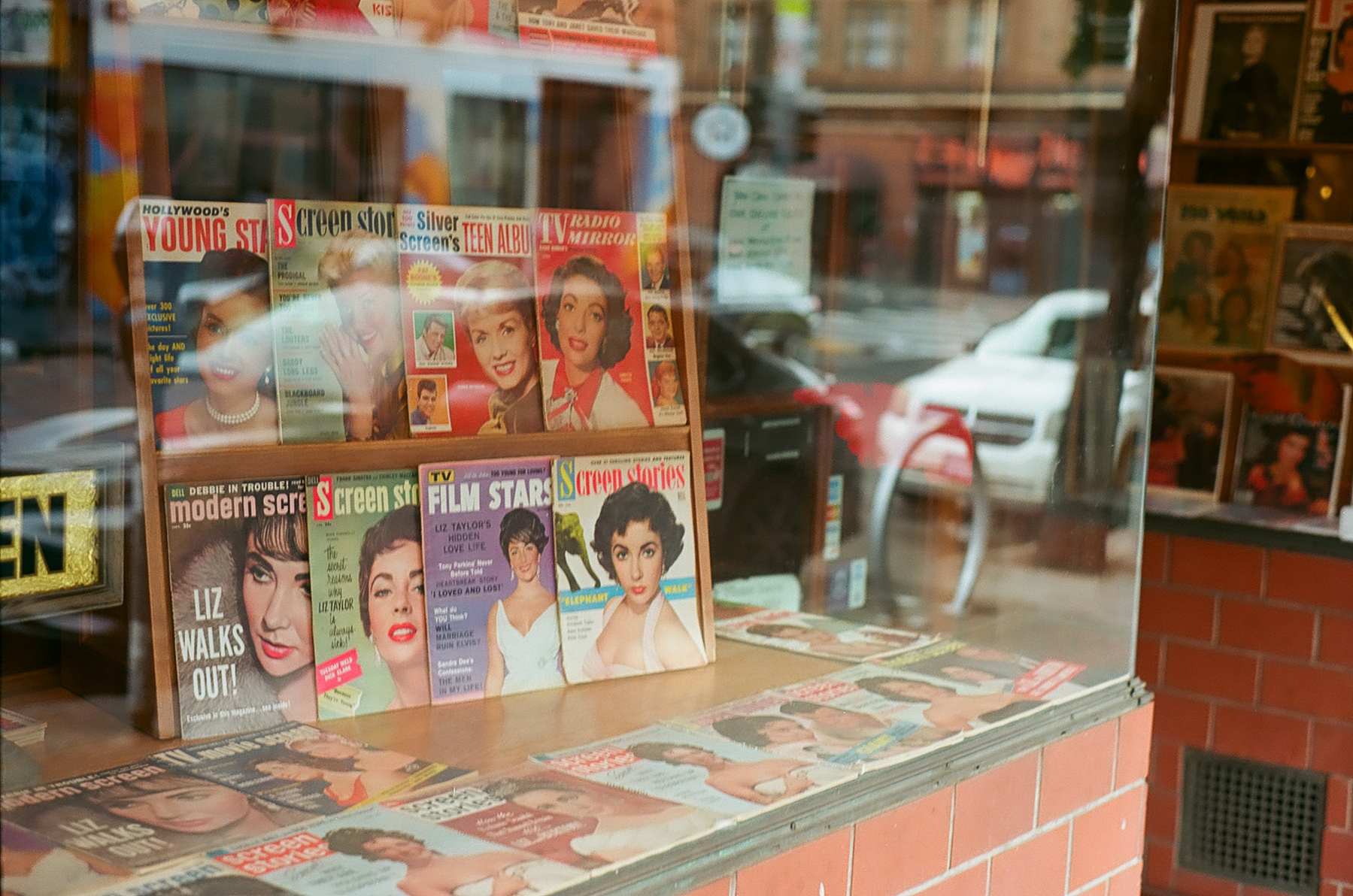 a color photograph of retro magazines in a storefront in San Francisco
