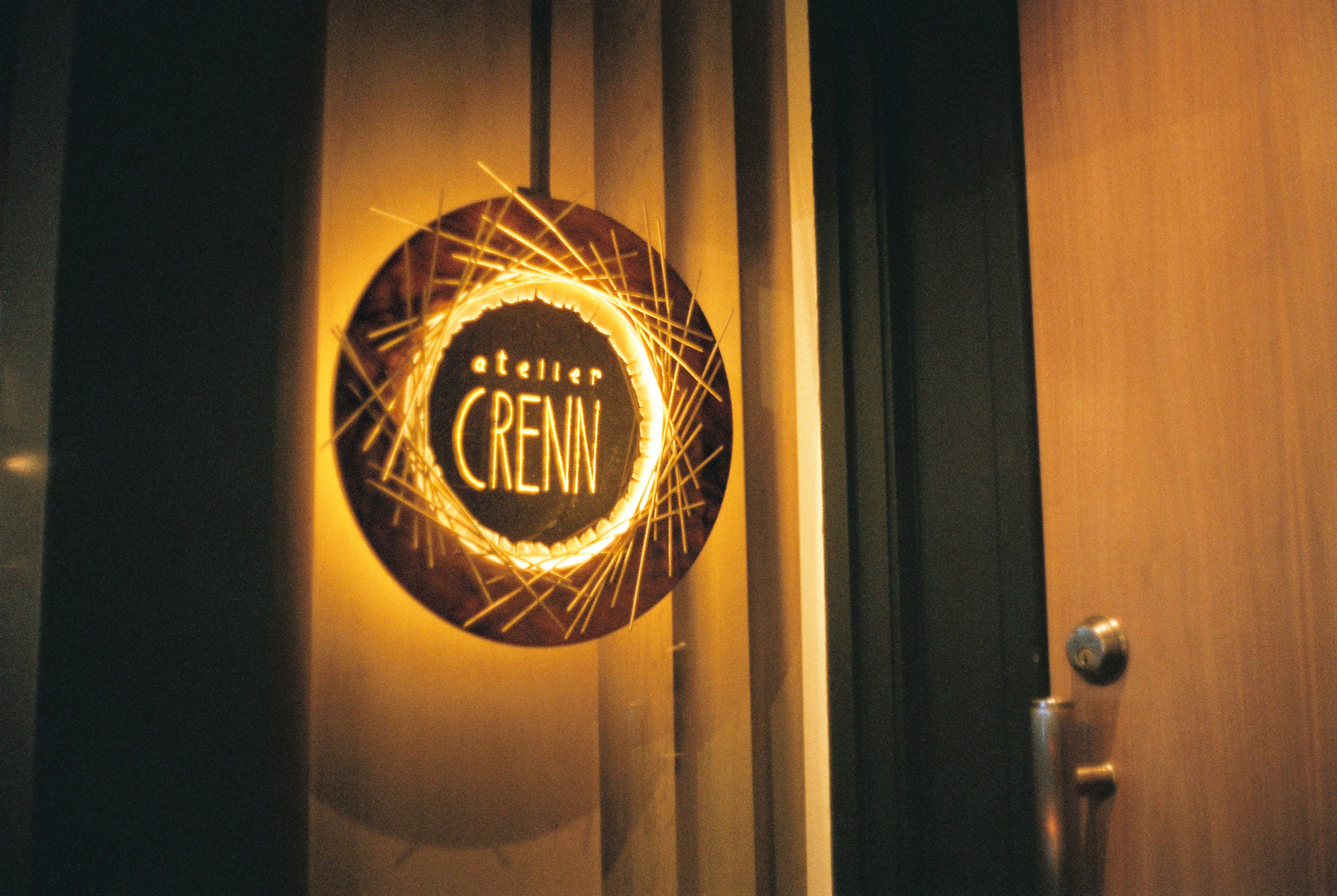 a scan of a color photo of the door of Atelier Crenn, a Michelin starred restaurant in San Francisco