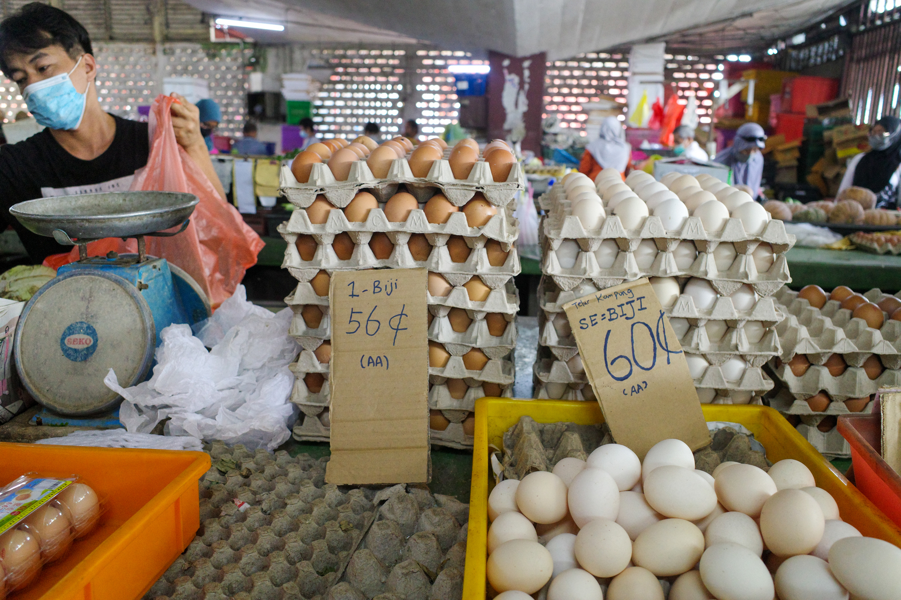 a digital photograph of a market in Malaysia with lots of eggs