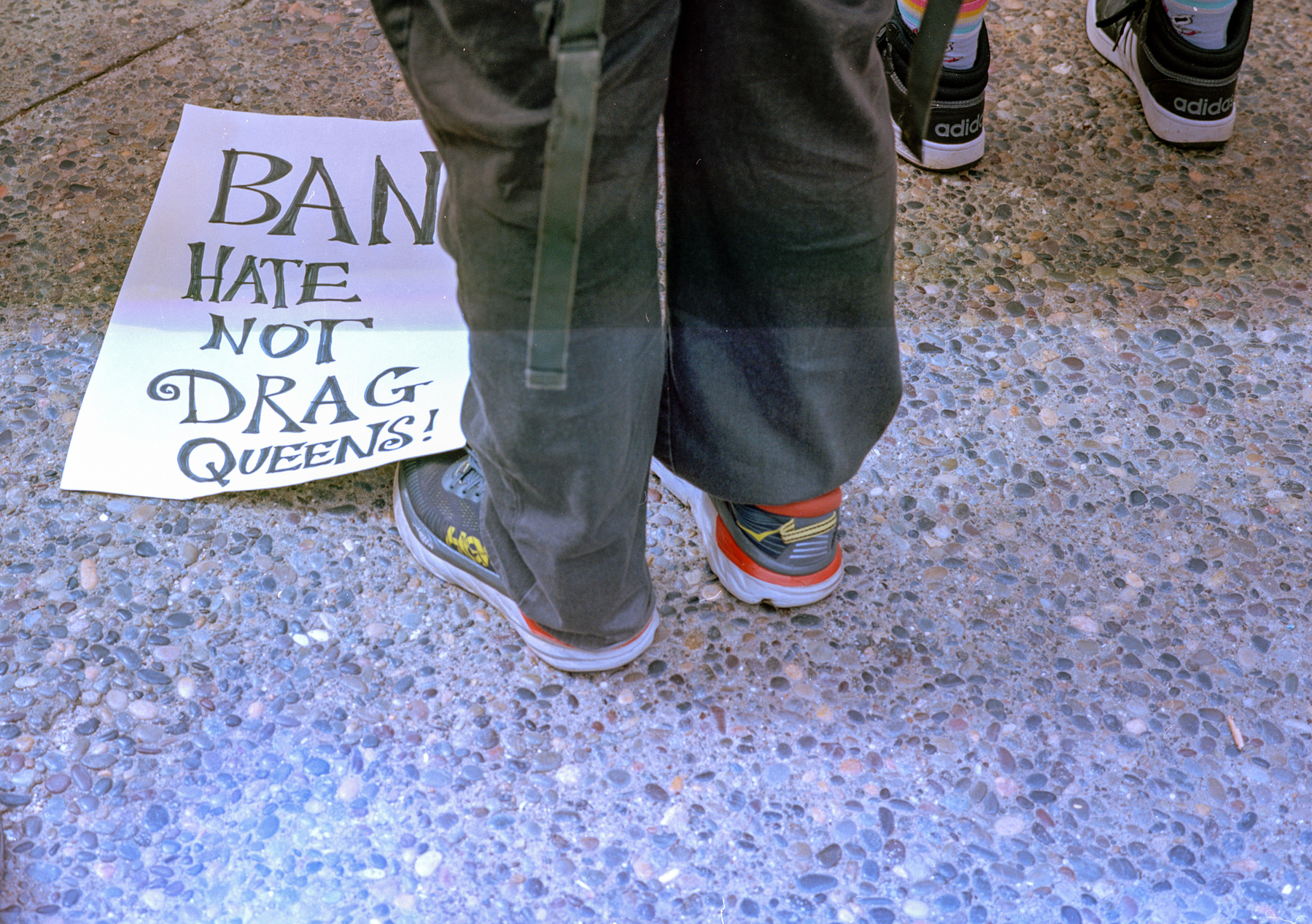 a scan of a color photo of a sign that says Ban Hate Not Drag Queens