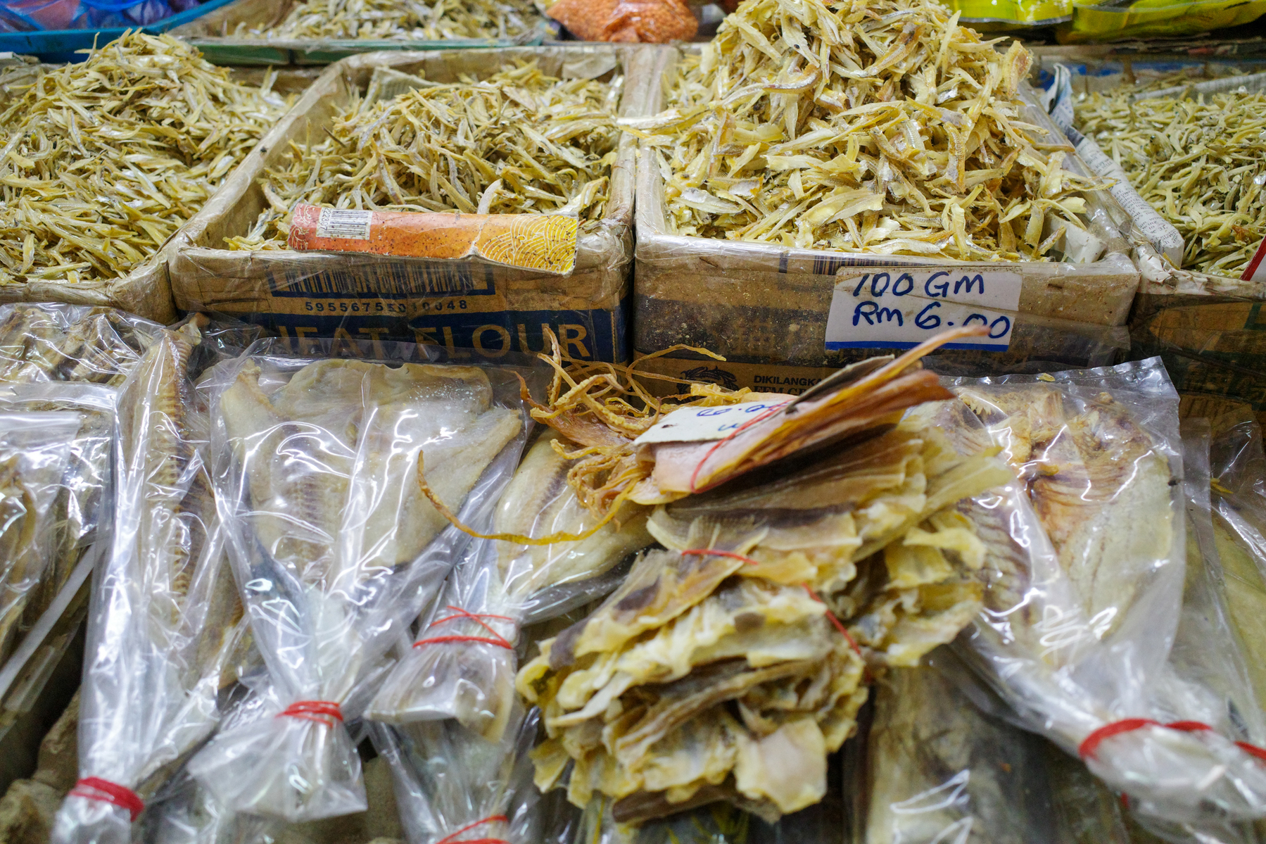 a digital photograph of a market in Malaysia with lots of salted fish