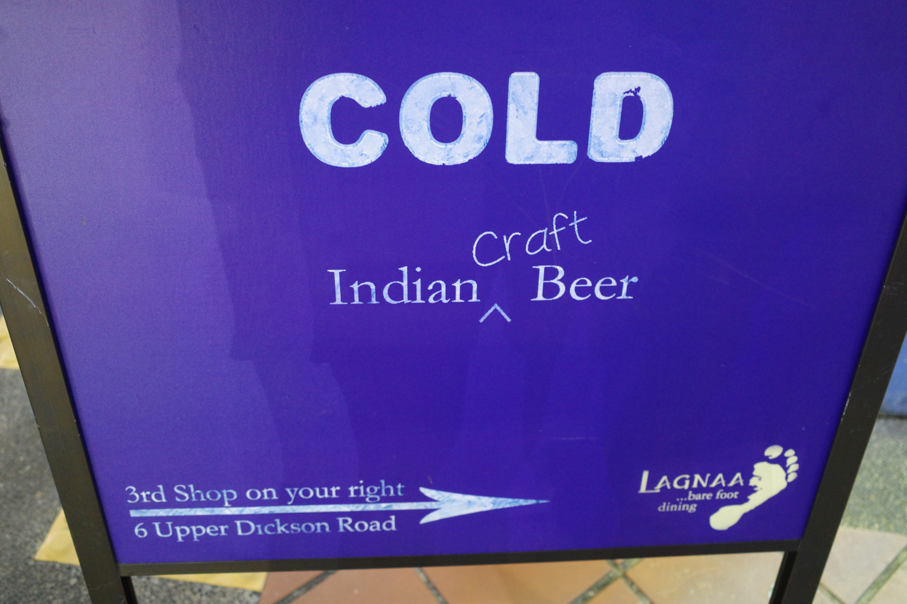a color photo of a sign that says cold craft Indian beer