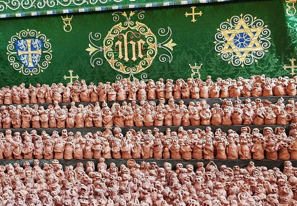 Thousands of terracotta figures representing the players and supporters of the Ashbourne football game.