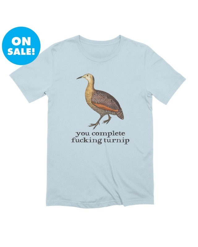 a t-shirt featuring an illustration of a bird above the text you complete fucking turnip