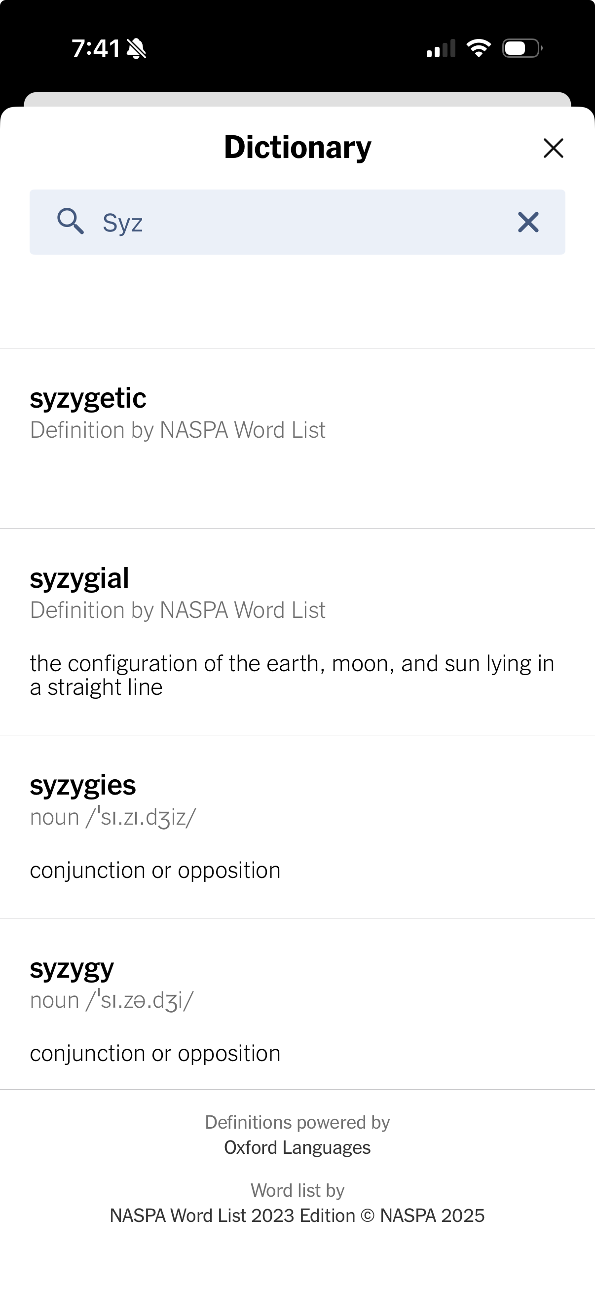 Screenshot of a smart phone dictionary app displaying definitions for words like syzygetic and syzygy.