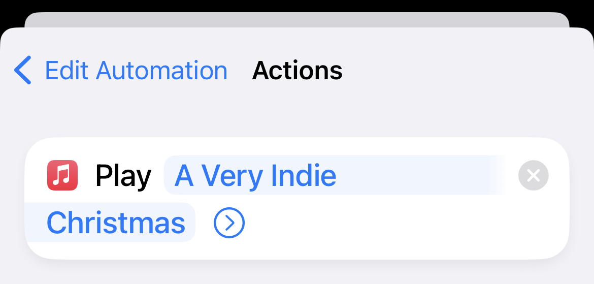 screenshot of the details of the music action: play infie christmas playlist on shuffle.