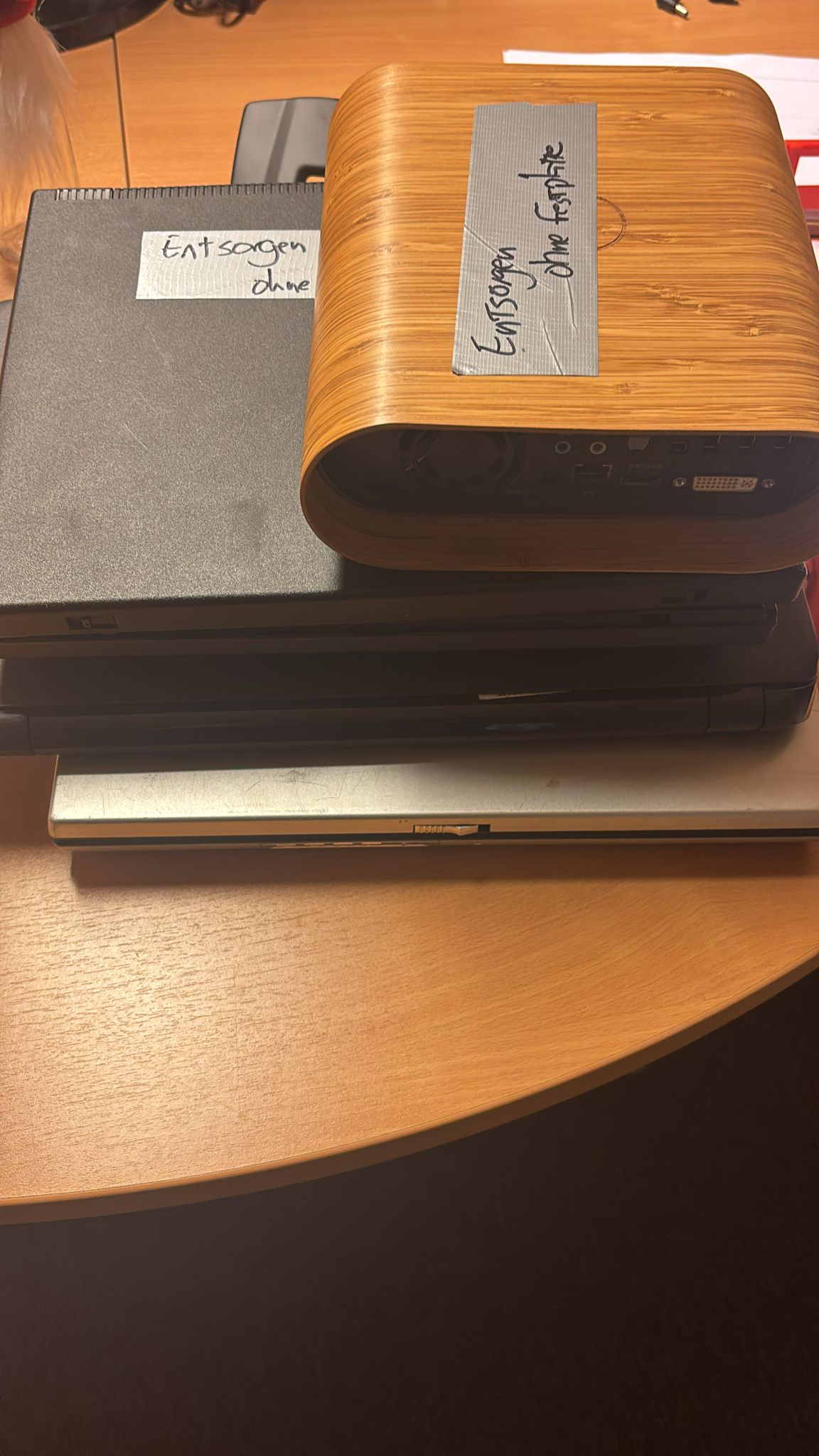 A stack of ancient computers, relieved of their hard drives, ready for recycling. 