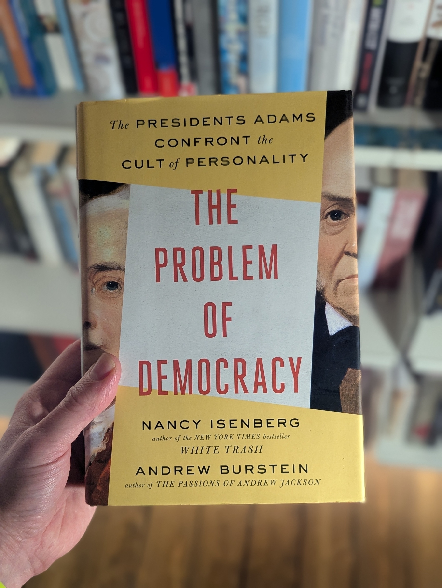 Cover of The Problem of Democracy in front of my bookshelf