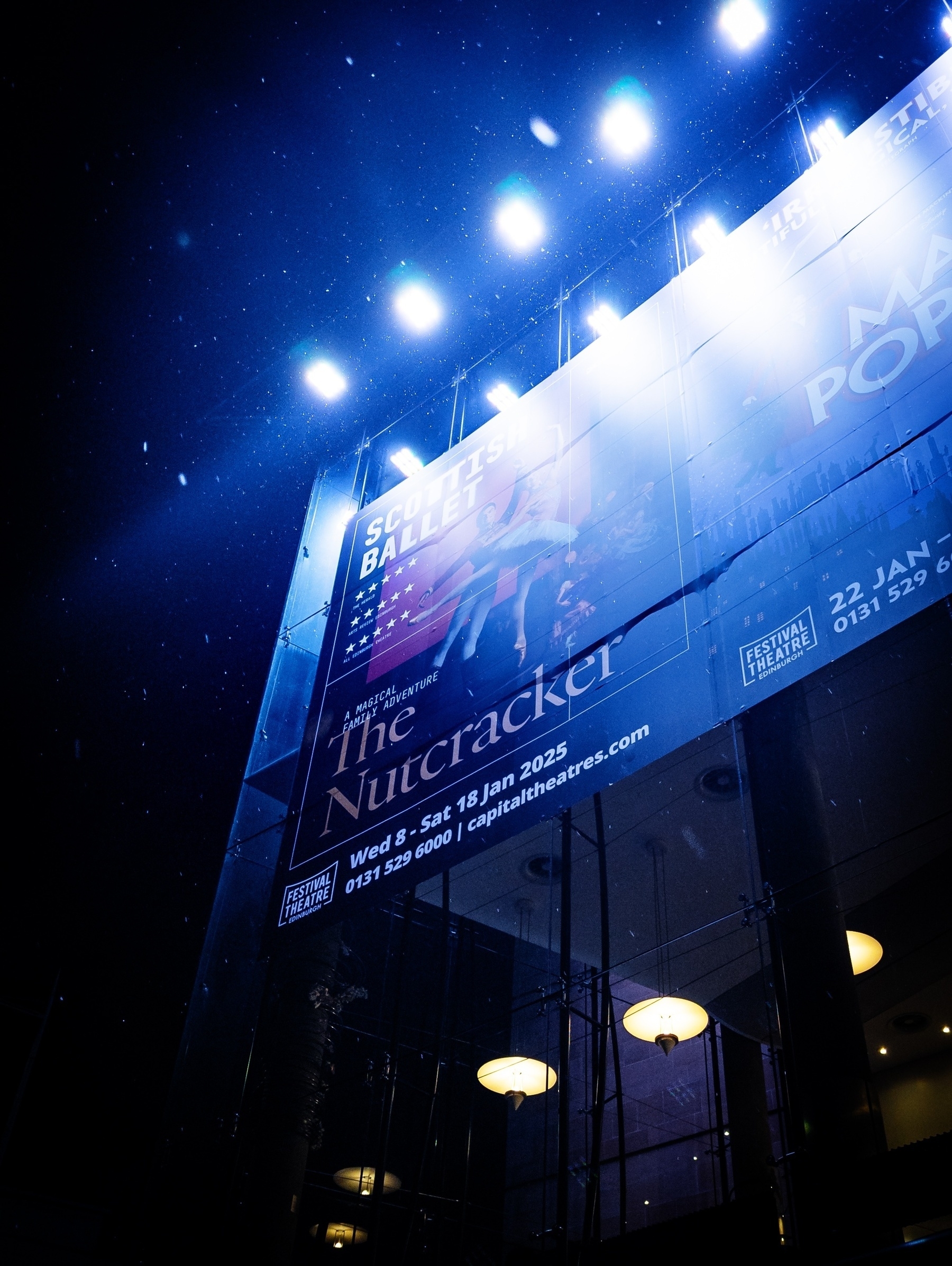 Sign outside the Festival Theatre for The Nutcracker, with a little snow falling 