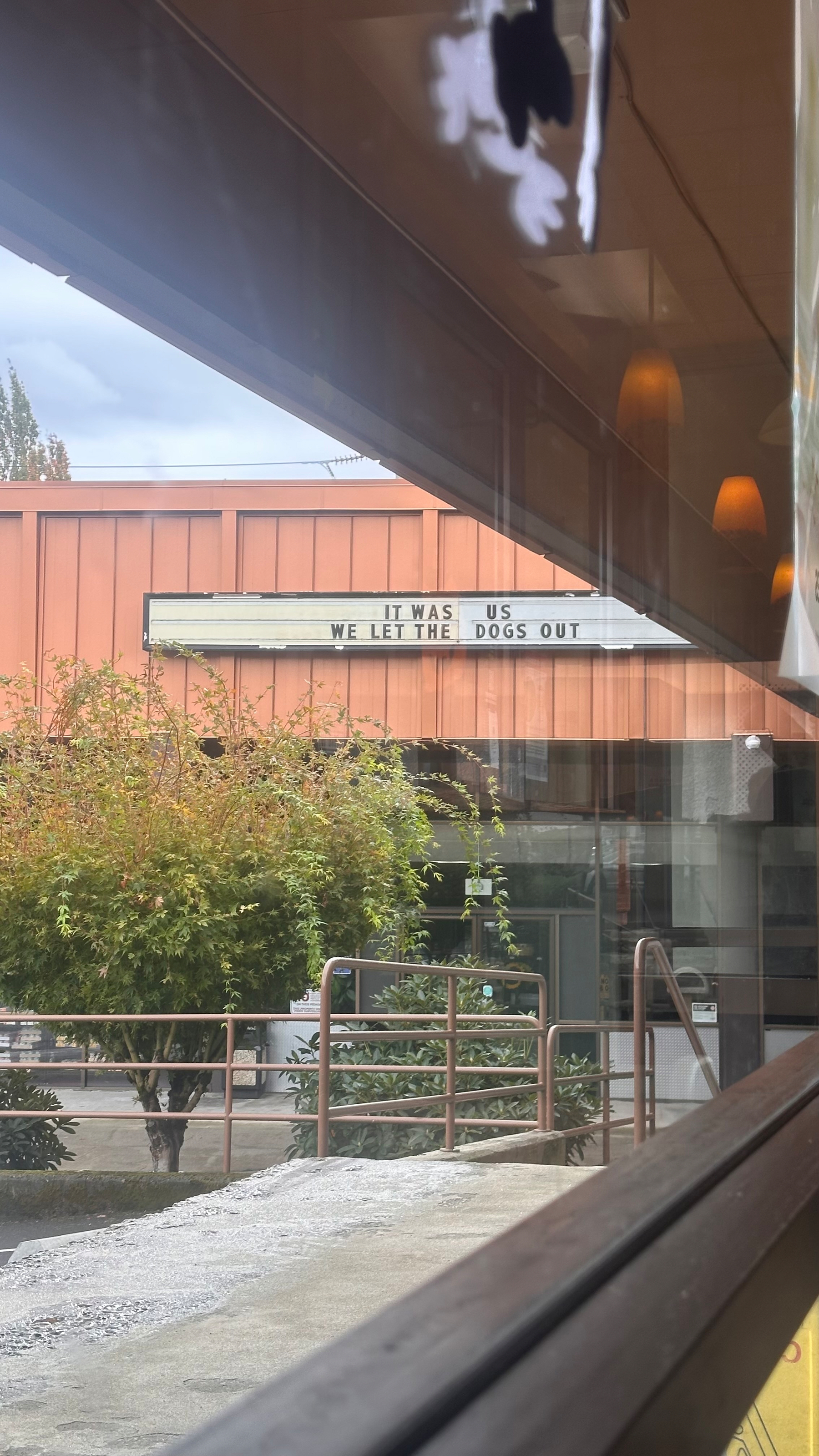 Removable letters on a pet supply business reads “It was us. We let the dogs out.”