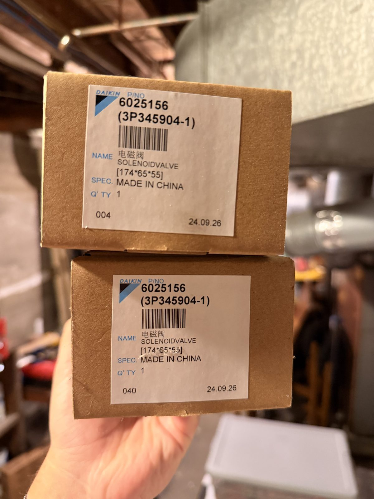 Two identical Daikin part boxes labeled 6025156, SOLENOIDVALVE