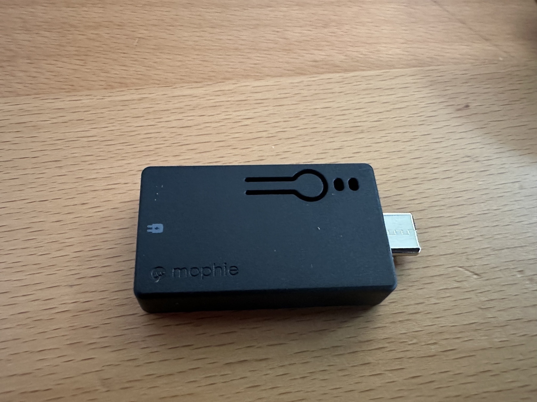 Small black USB key with a button