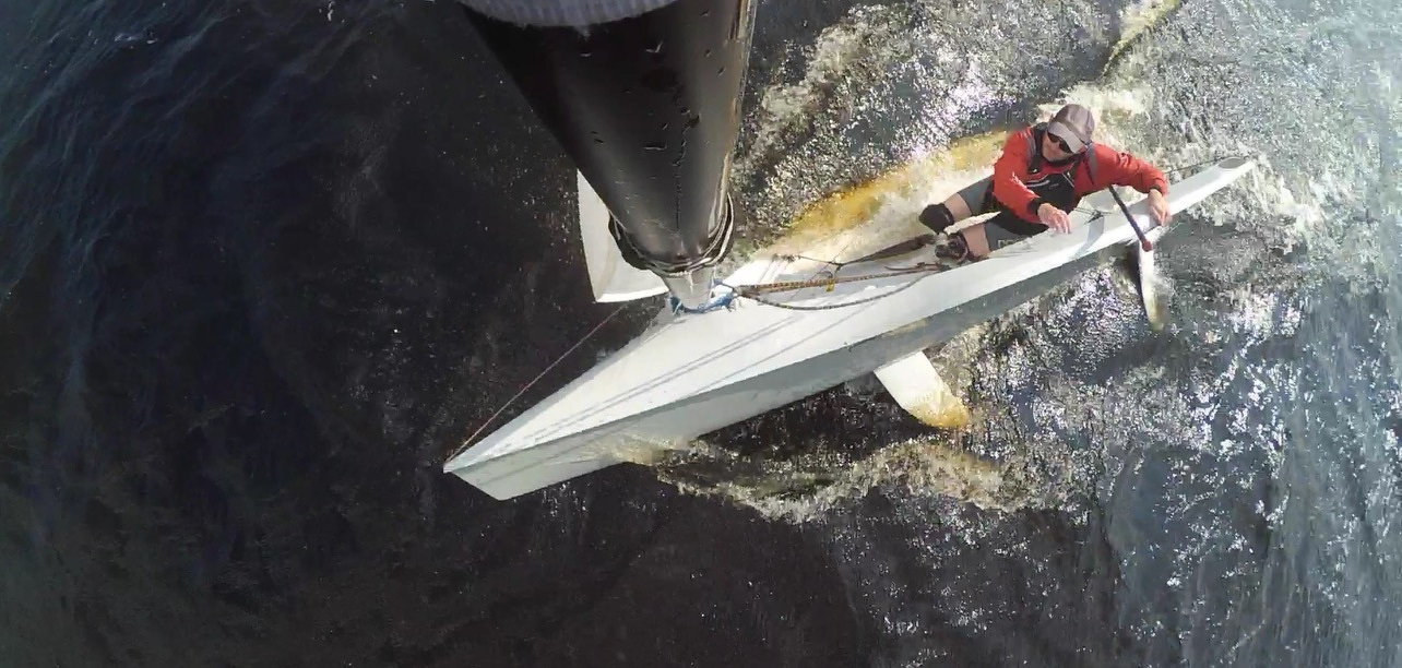 A man in a sailing dinghy on the verge of a capsize. He looks scared, and should be. He’ll never win that race now!