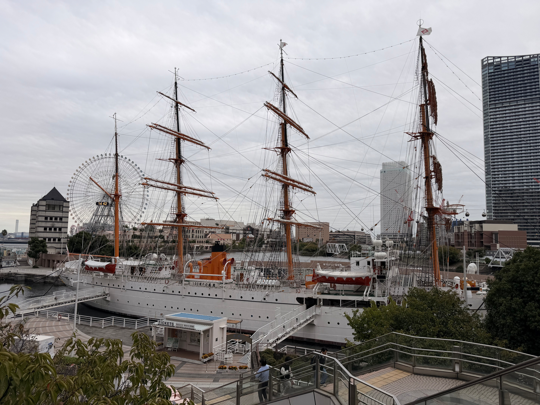 Photo of a large, four masted sailing ship in the Yokohama harbor