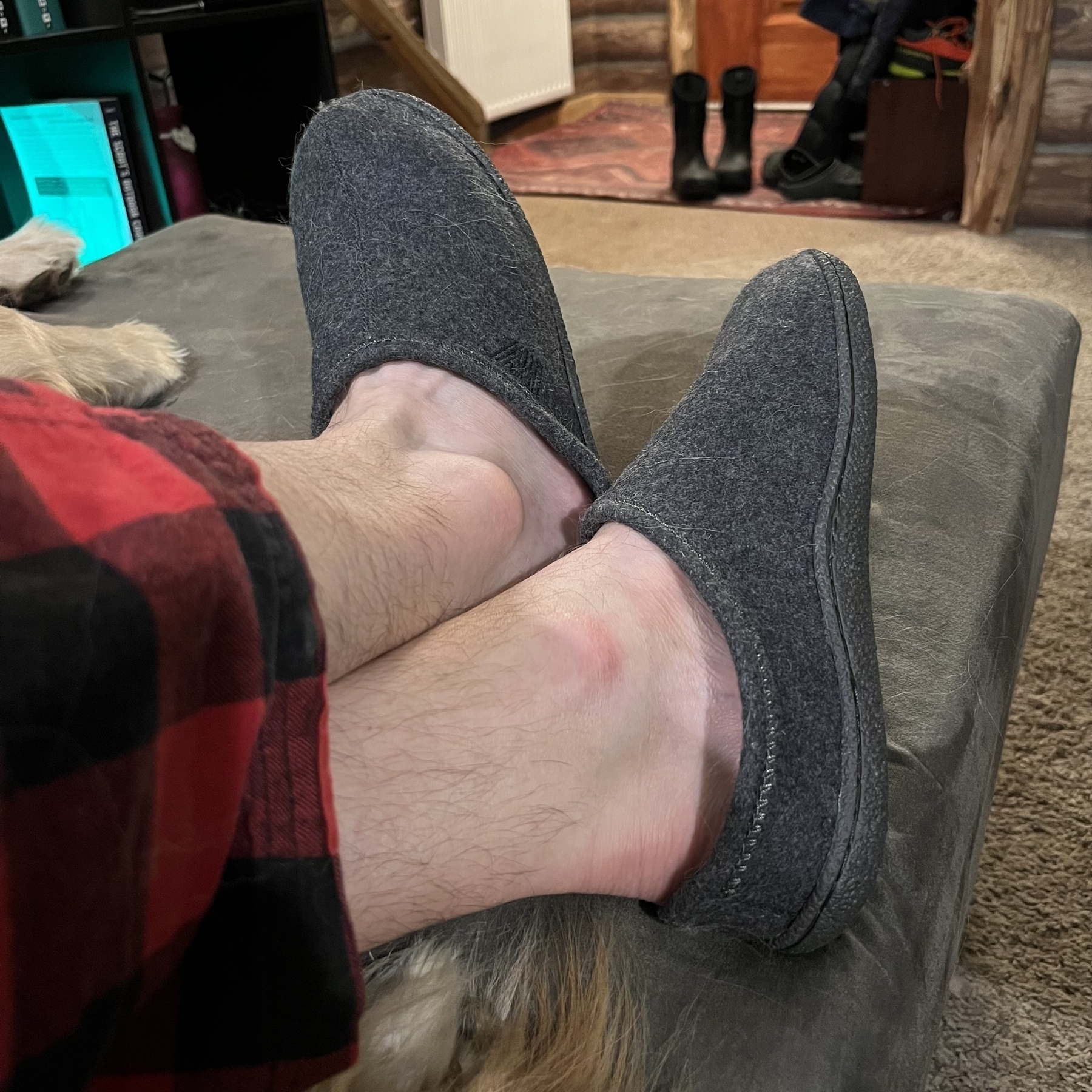Gray slippers on feet.