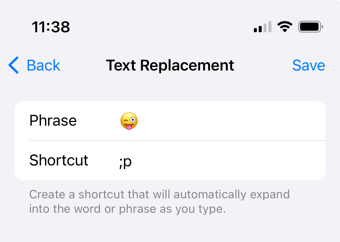 Text Replacement settings screen showing “;p” replaced with 😜