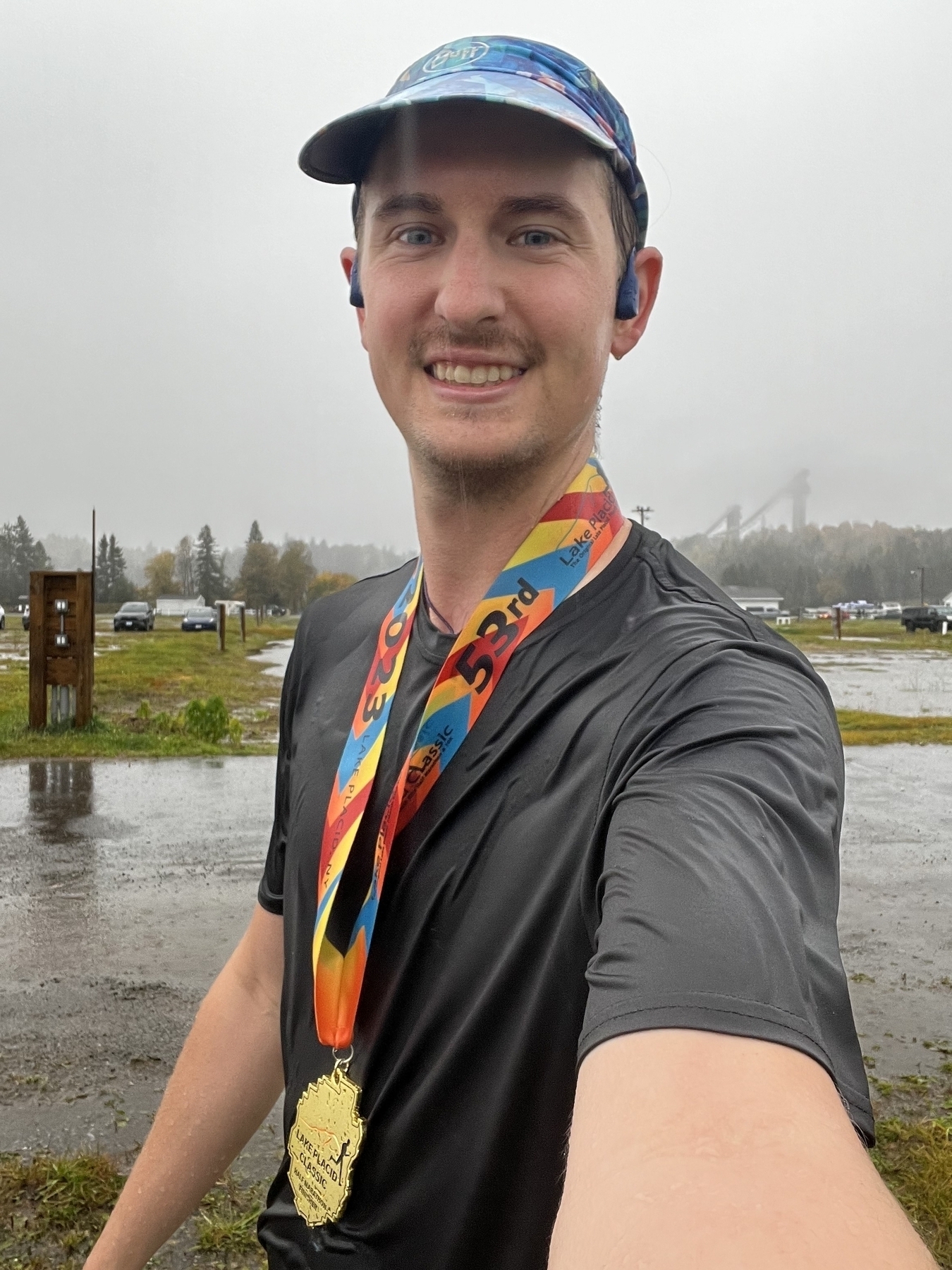 Me, soaked but wearing a smile and a medal.
