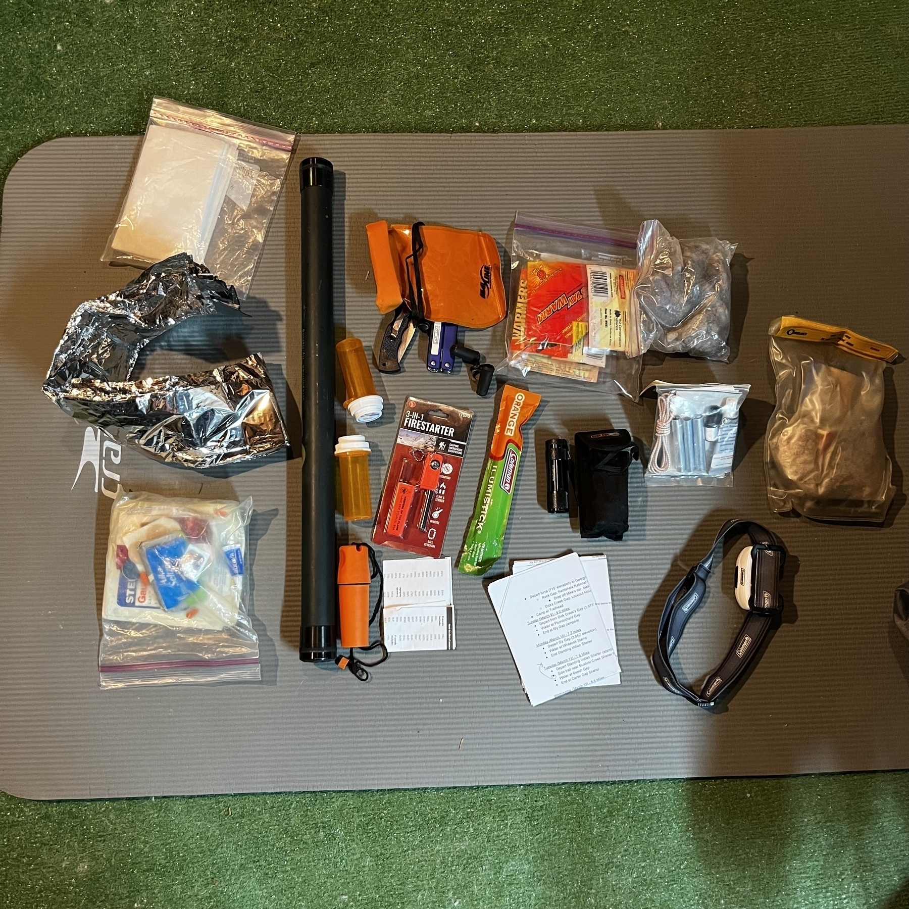 Fire starters, knives, flashlights, bags, and first aid supplies.