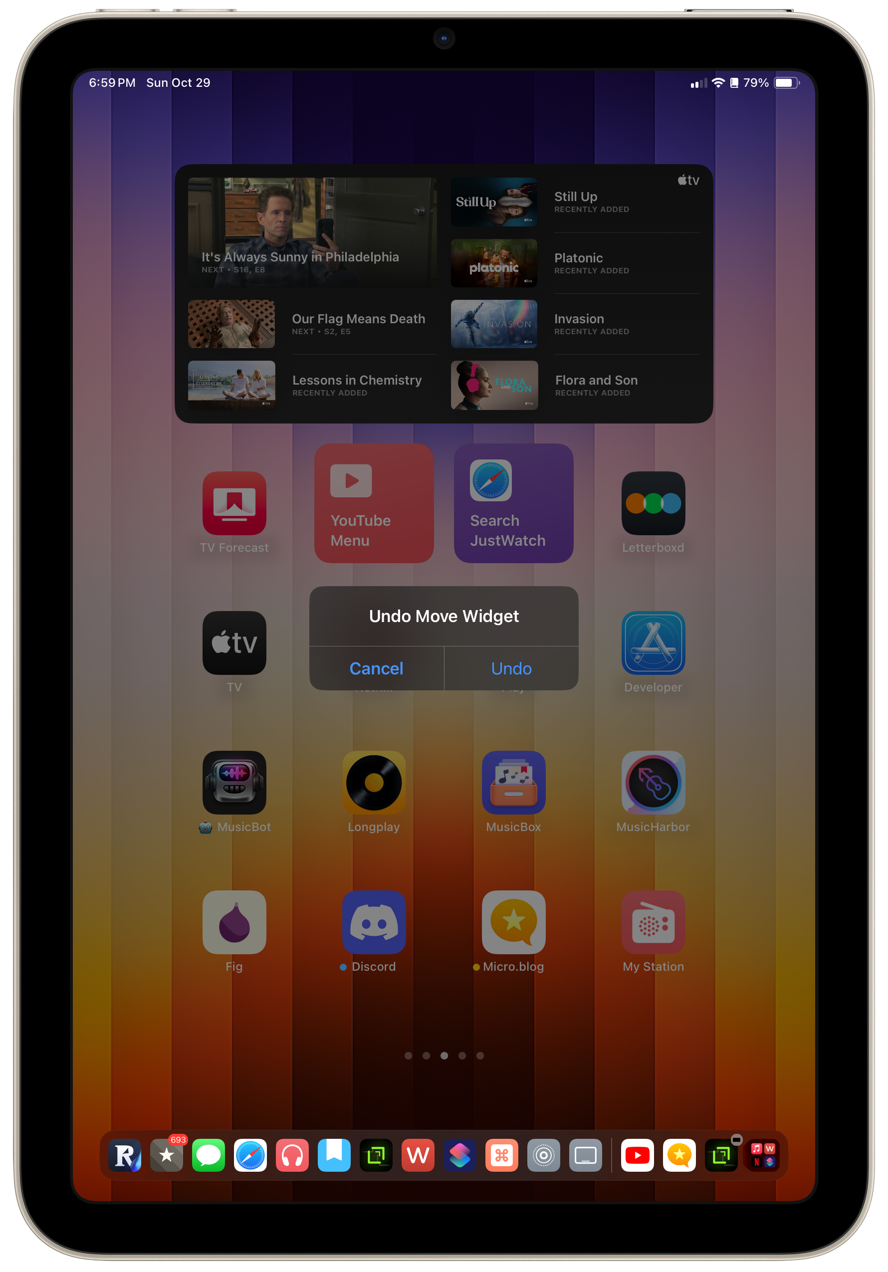 iPad Home Screen showing an ‘Undo Move Widget’ popup.