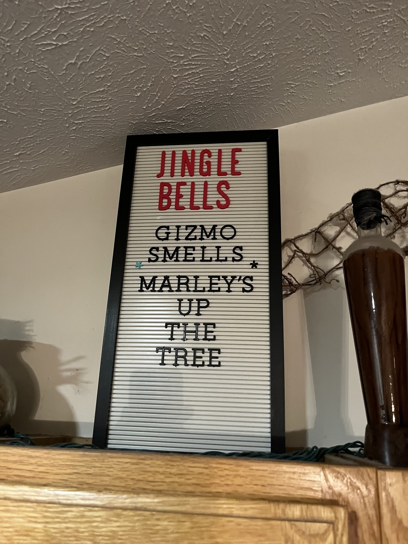 An add-your-own-text sign that says “jingle bells, gizmo smells, Marley’s up the tree”.